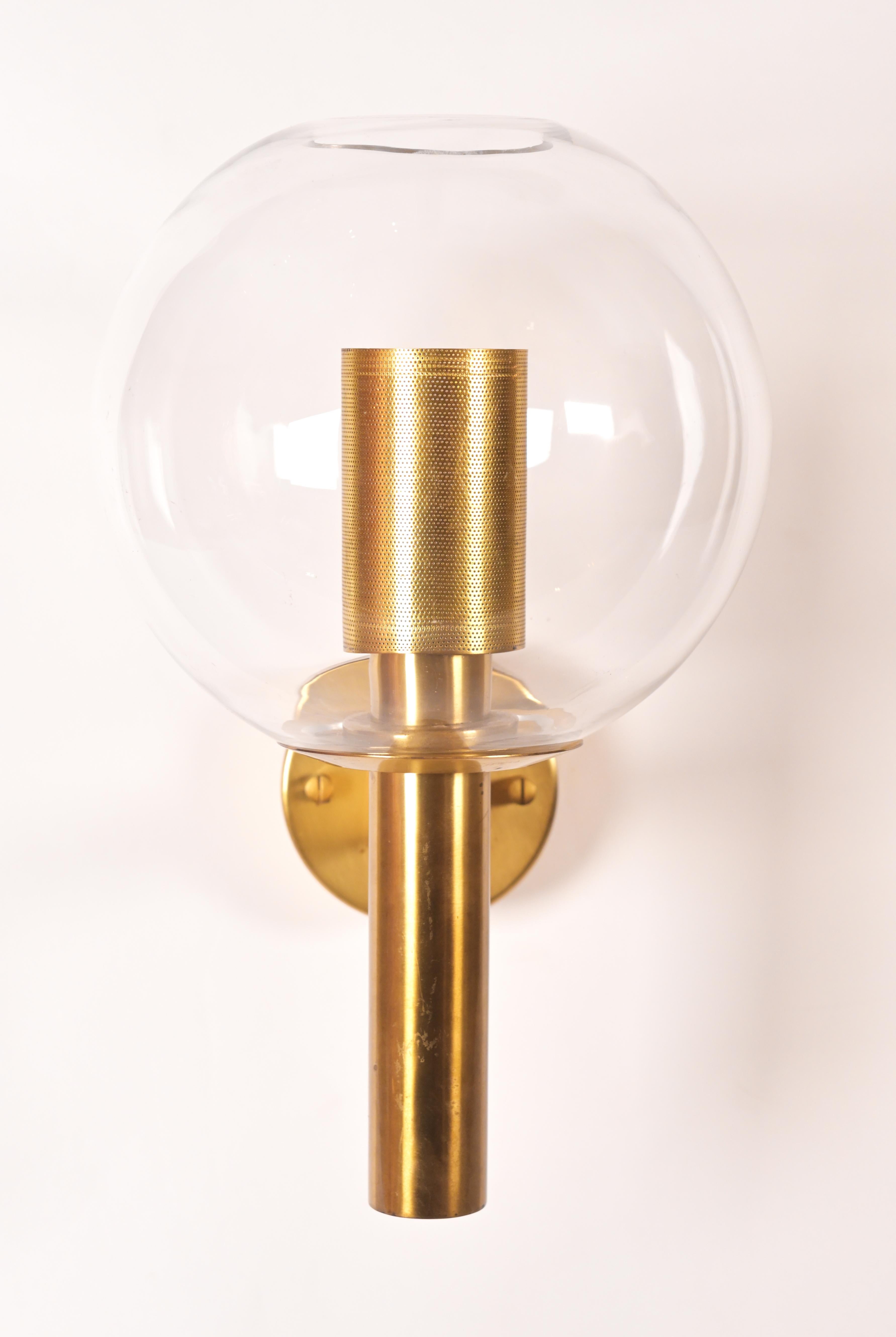 Wall lamps model V-80 by Swedish designer Hans-Agne Jakobsson (1919-2009) having simplistic brass framing with spherical glass shade. 3 are available. UL wiring included in pricing.
