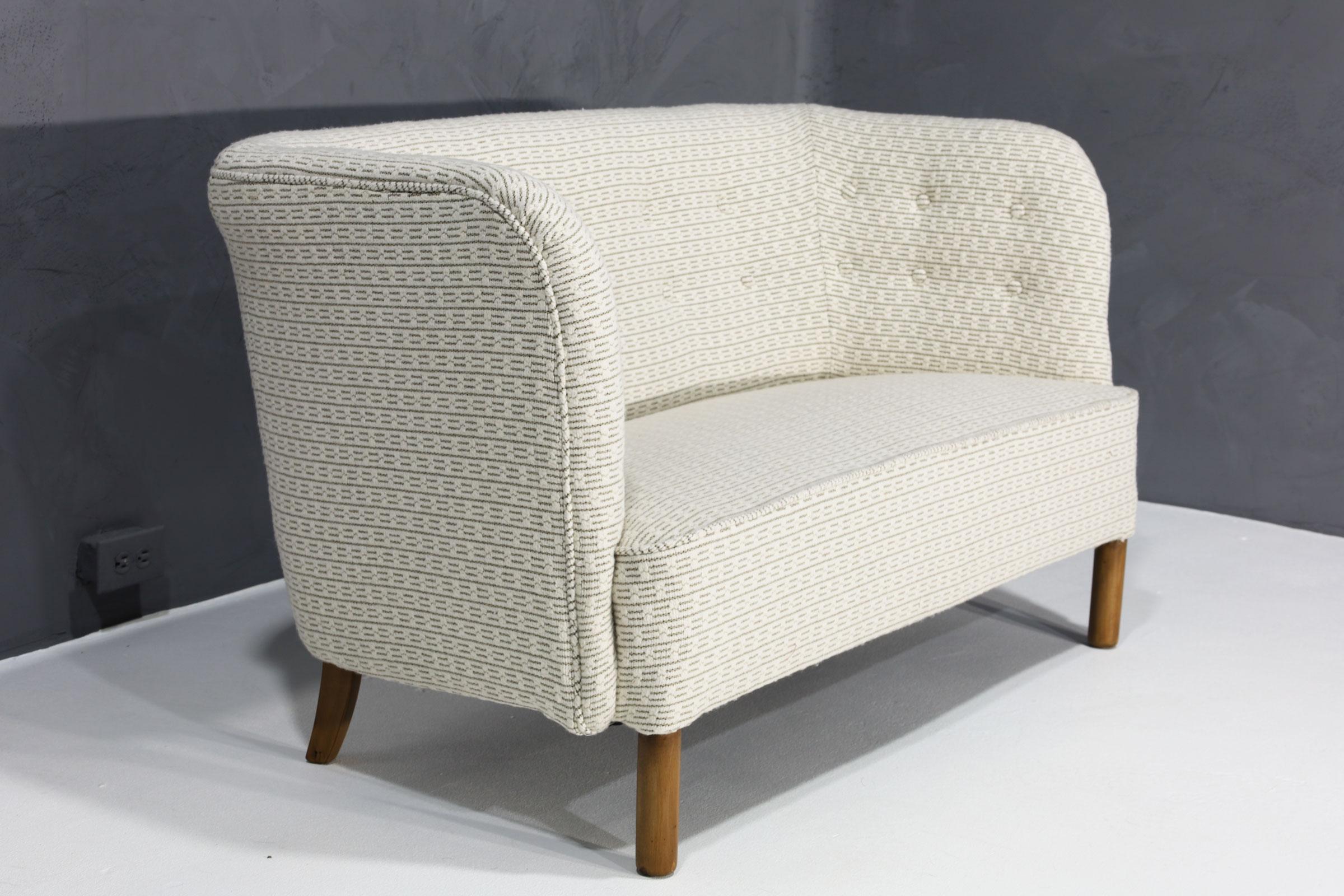 We have reupholstered this beautiful high quality settee designed by Agner Christoffersen in a rich textured Kelly Wearstler fabric.