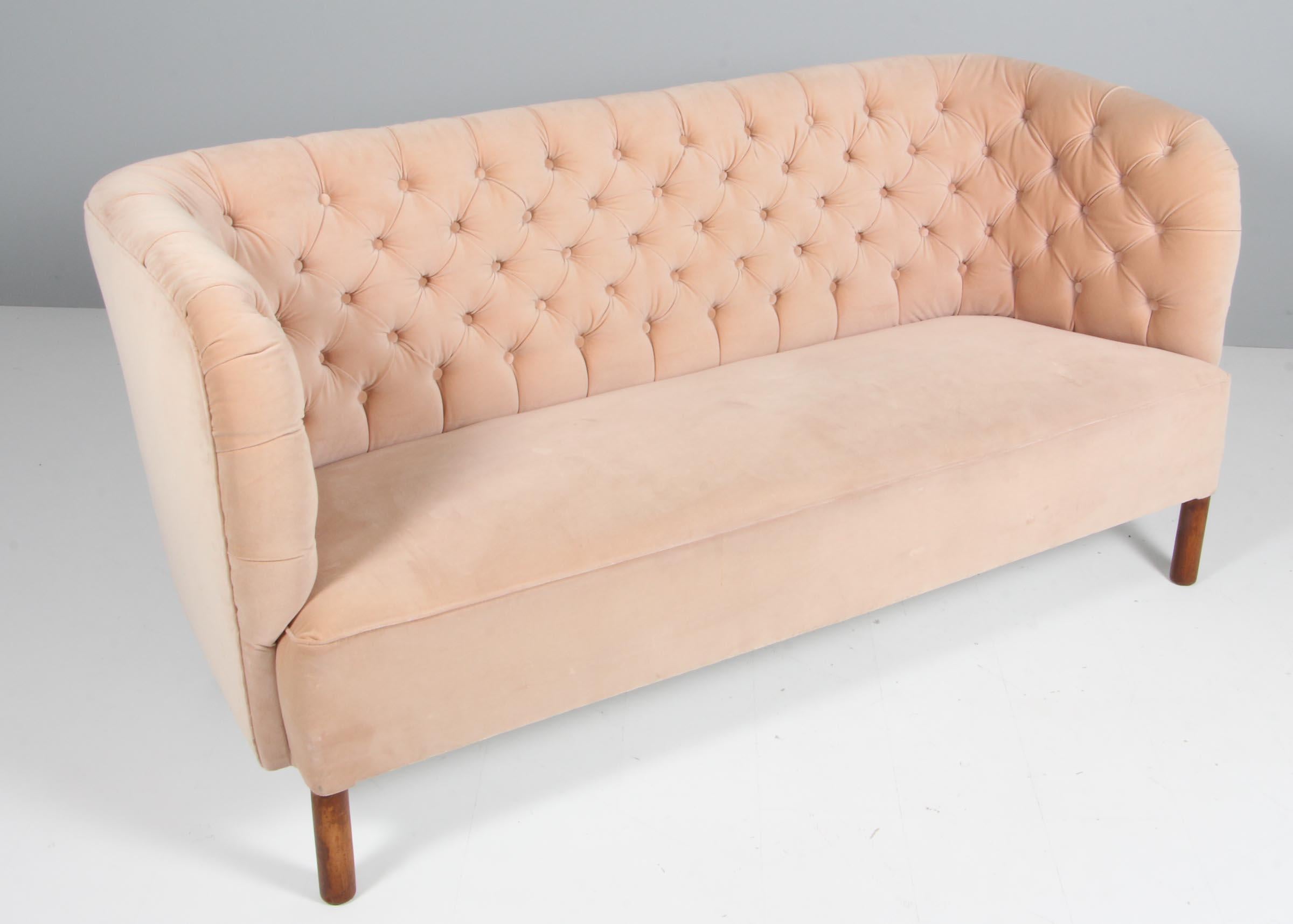 An early Danish modernist sofa with an organic form similar to works by important architects such as Viggo Boesen, Philip Arctander, Peder Moos and Flemming and Mogens Lassen. Presumably manufactured by N,C. Christophersen, in the 1940s