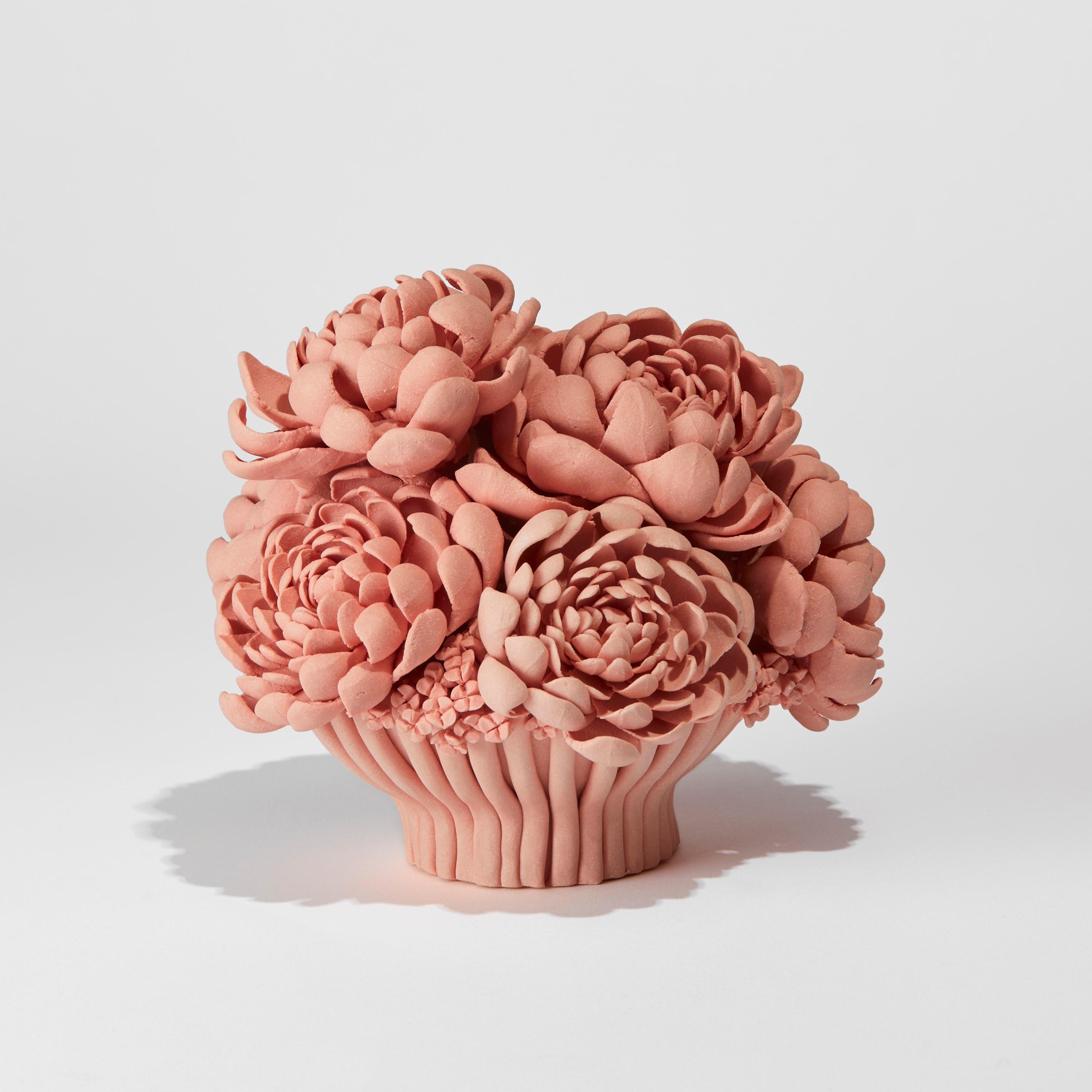 Agnes, is a unique handcrafted coral pink porcelain sculpture and centrepiece completely covered in individually made porcelain flowers of all different shapes and forms by the British artist, Vanessa Hogge.

Vanessa Hogge breathes life into her