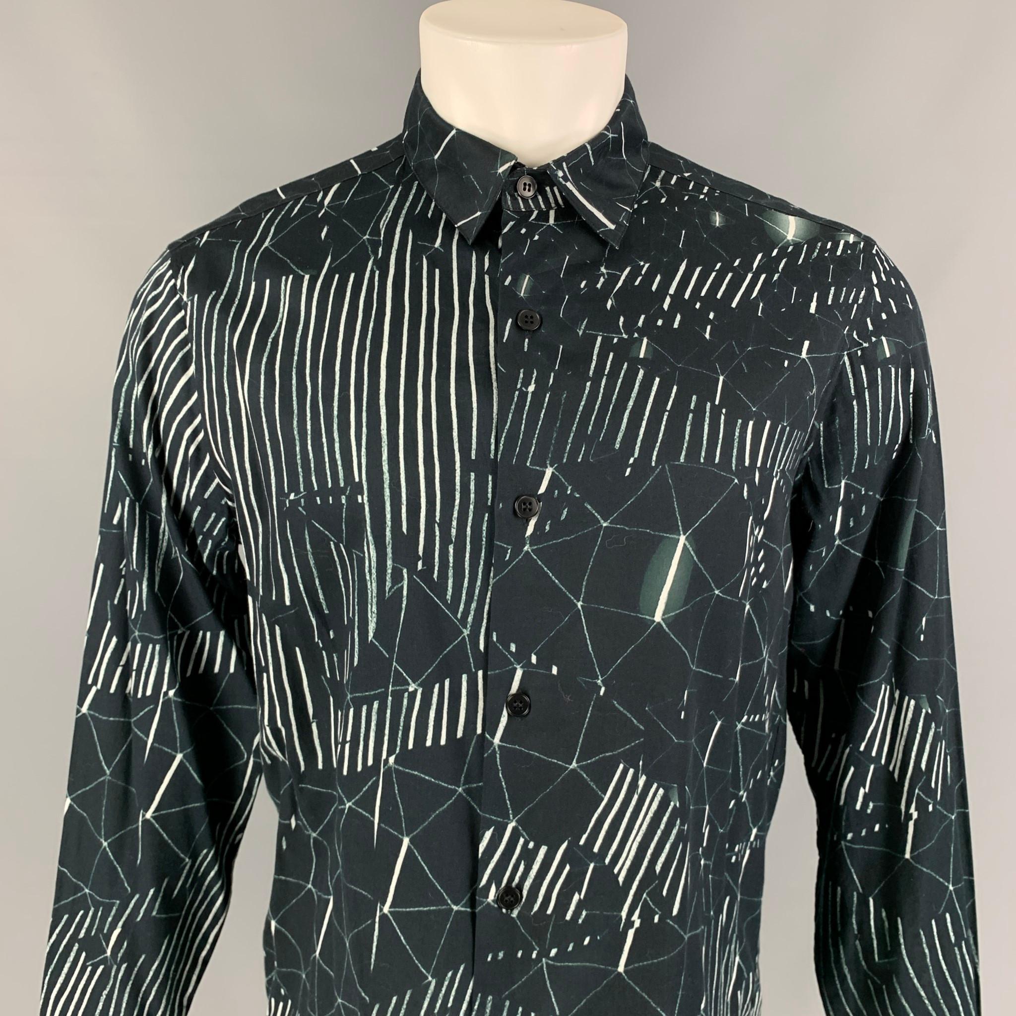 AGNES B. 'Baudelocque' long sleeve shirt comes in a navy & white print cotton featuring a spread collar and a button up closure. 

Very Good Pre-Owned Condition.
Marked: 42

Measurements:

Shoulder: 18 in.
Chest: 42 in.
Sleeve: 26 in.
Length: 28 in. 