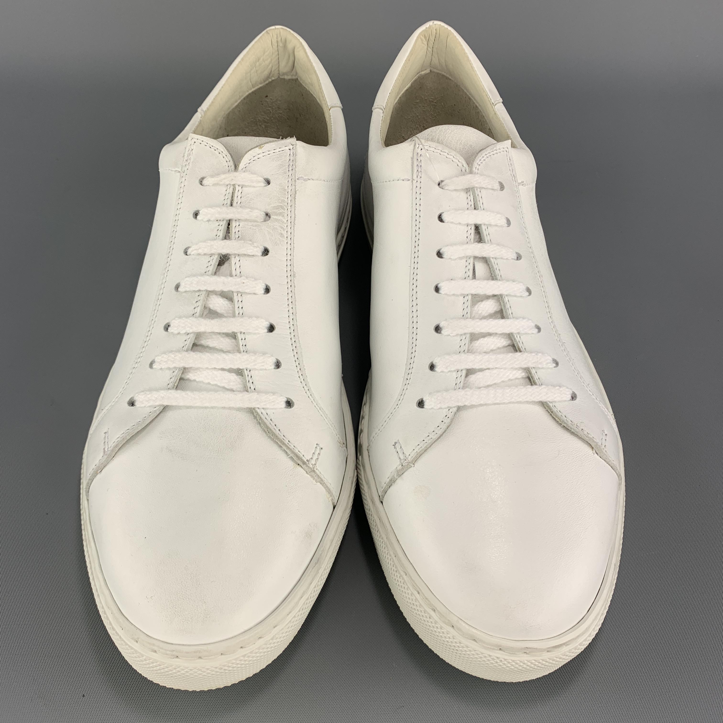 AGNES B. low top sneakers come in matte white leather with a lace up front and white rubber sole. 

Excellent Pre-Owned Condition.
Marked: IT 43

Outsole: 11.75 x 4 in.