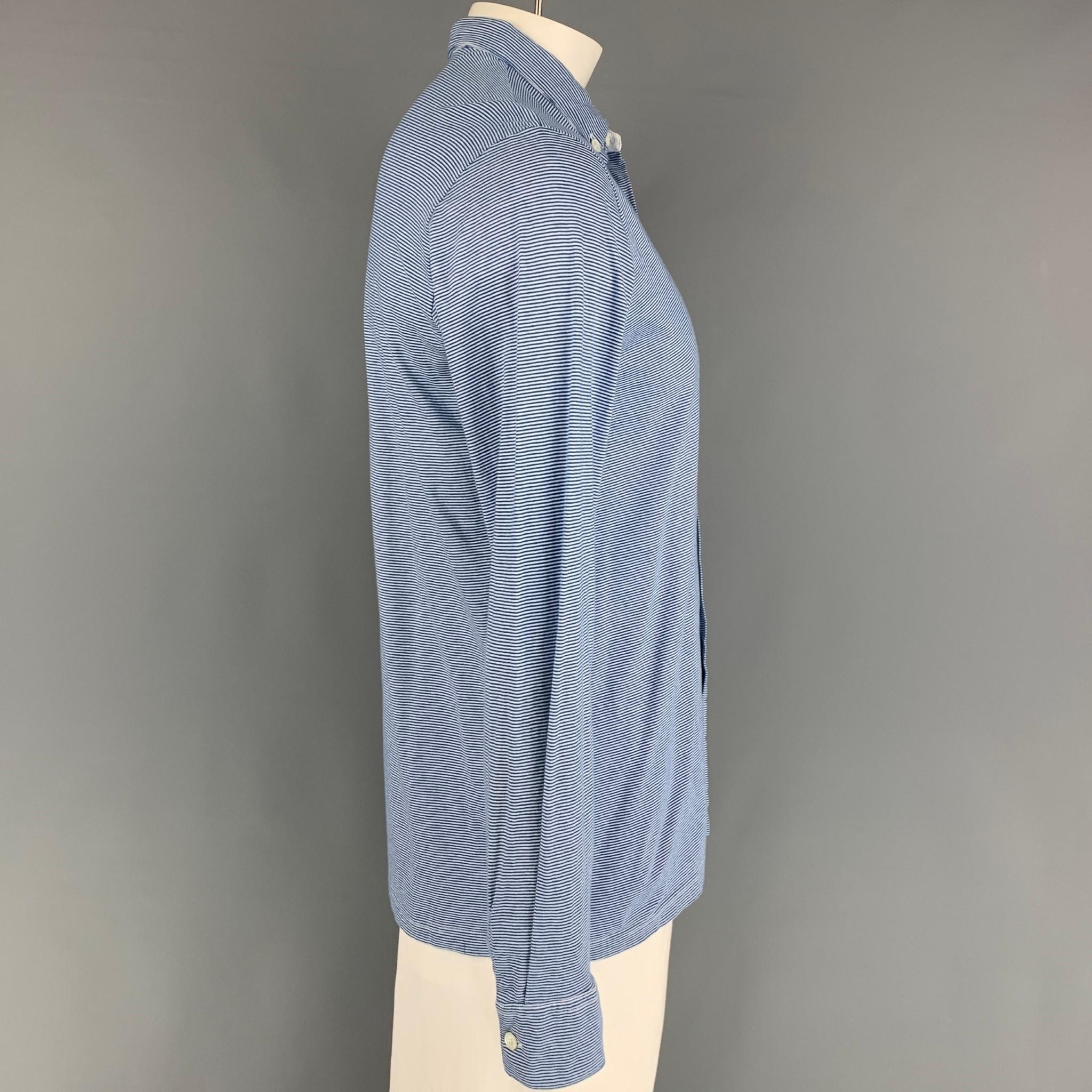 AGNES B. long sleeve shirt comes in a blue & white stripe cotton featuring a button down collar and a button up closure. 

Very Good Pre-Owned Condition.
Marked: 3

Measurements:

Shoulder: 18.5 in.
Chest: 40 in.
Sleeve: 27 in.
Length: 28.5 in. 
