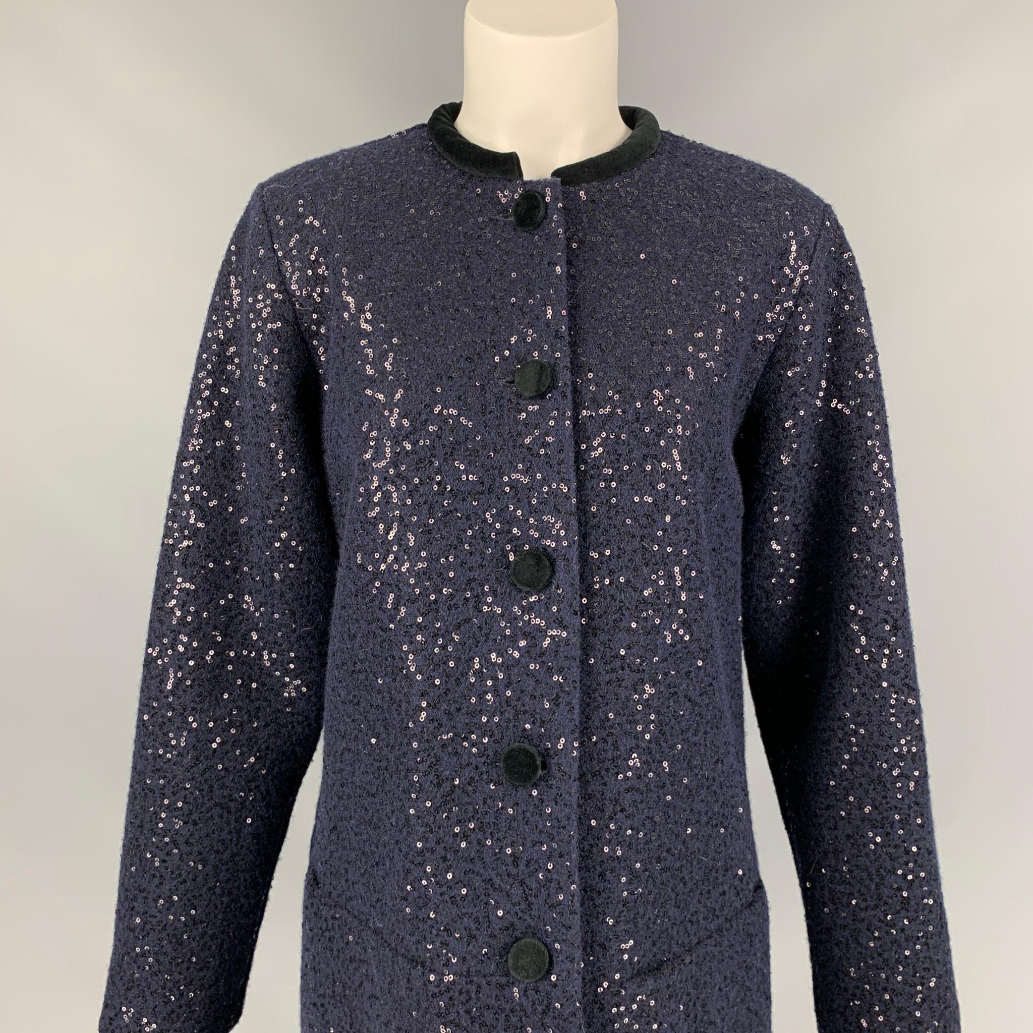 AGNES B. coat comes in a navy sequined material with a full liner featuring a collarless style, velvet trim, and a buttoned closure. Made in Romania. 

Good Pre-Owned Condition. Fabric tag removed.
Marked: 3

Measurements:

Shoulder: 16 in.
Bust: 38