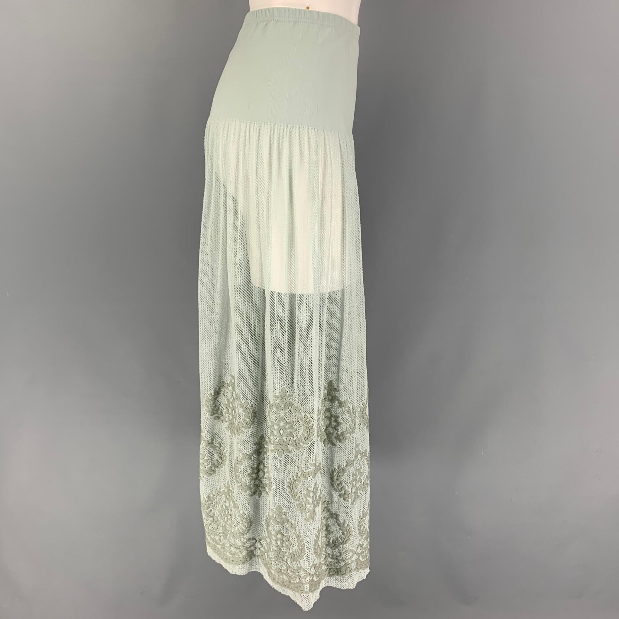AGNES B. skirt comes in a sea foam polyamide blend featuring a mesh panel, embroidered design, and a elastic waist. Made in Japan. 

Very Good Pre-Owned Condition.
Marked: TU

Measurements:

Waist: 24 in.
Hip: 32 in.
Length: 35 in. 