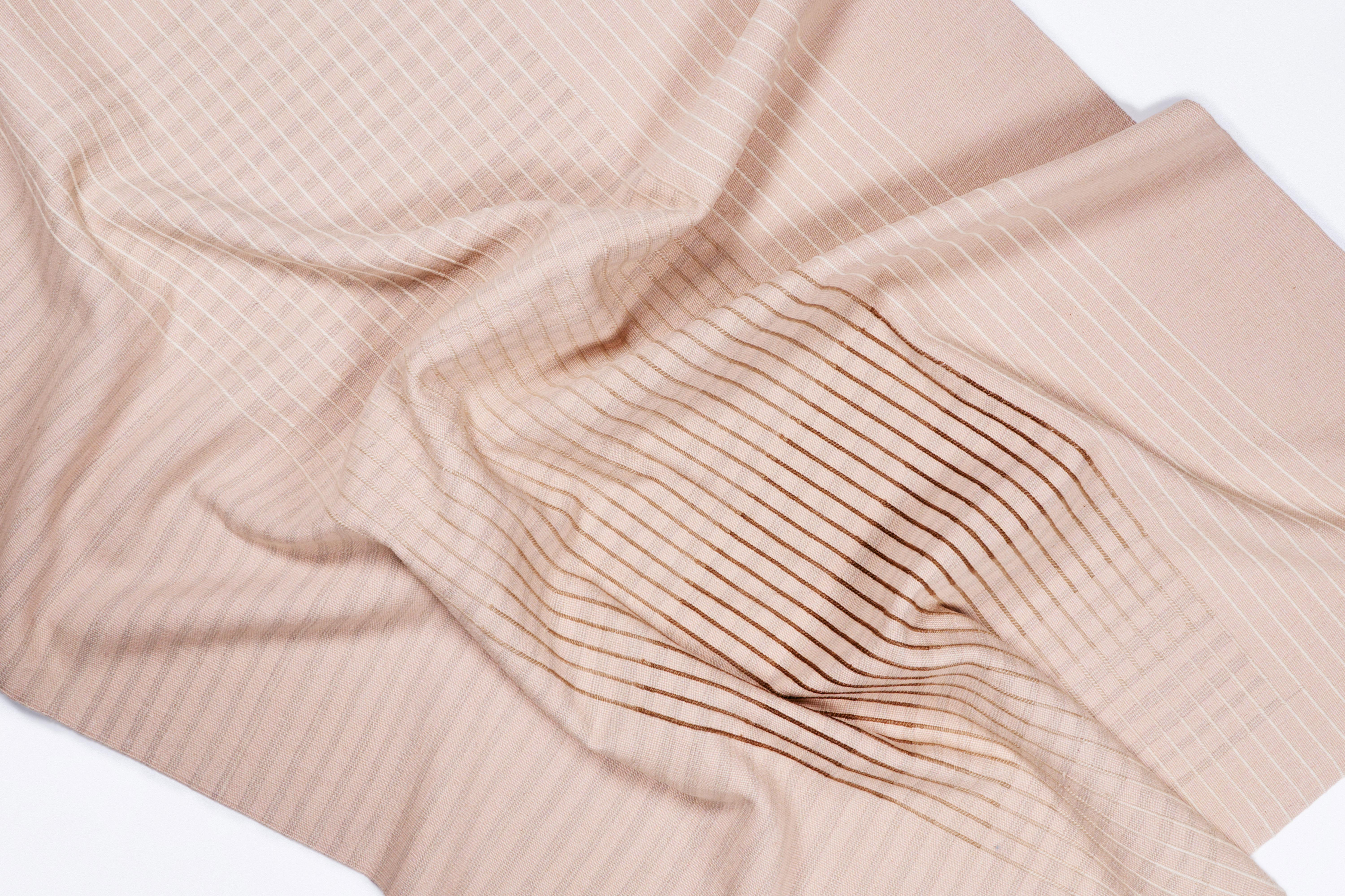 Inspired by Agnes Martin's delicate lines and the Japanese philosophy of Ma, AGNES contemporary handwoven area rug collection conveys a sense of simplicity and elegance. Its minimal design invites contemplation and serenity, a space for the mind to