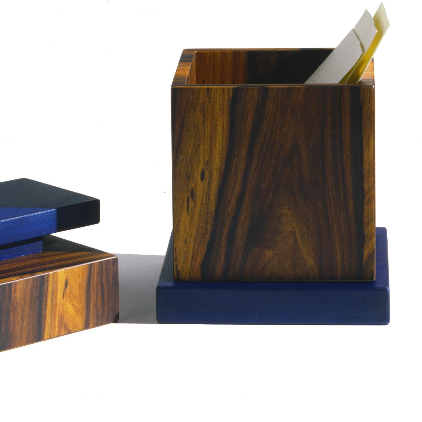 Distinguished for an extraordinary combination of three different types of wood, this stunning box designed by Ettore Sottsass is part of a limited edition of 99 pieces. Showcasing captivating hues of exquisite elegant flair, the box is made of