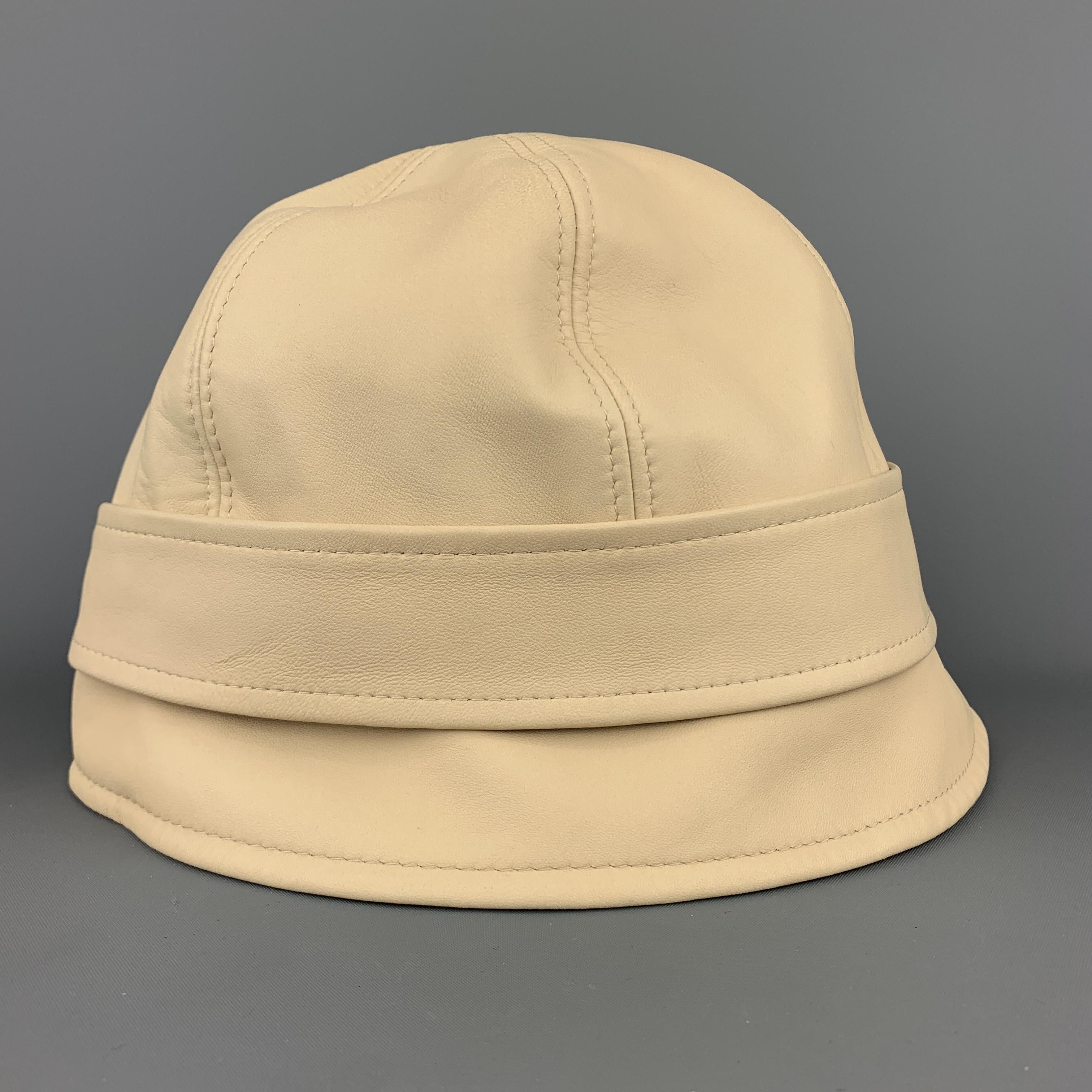 AGNONA vintage bucket style hat comes in beige leather with a strap and cream liner. Discoloration on back. As-is. Made in Italy.
 
Very Good Pre-Owned Condition.
Marked: (no size)
 
Measurements:
 
Opening: 23 in.
Brim: 2 in.
Height: 5 in.