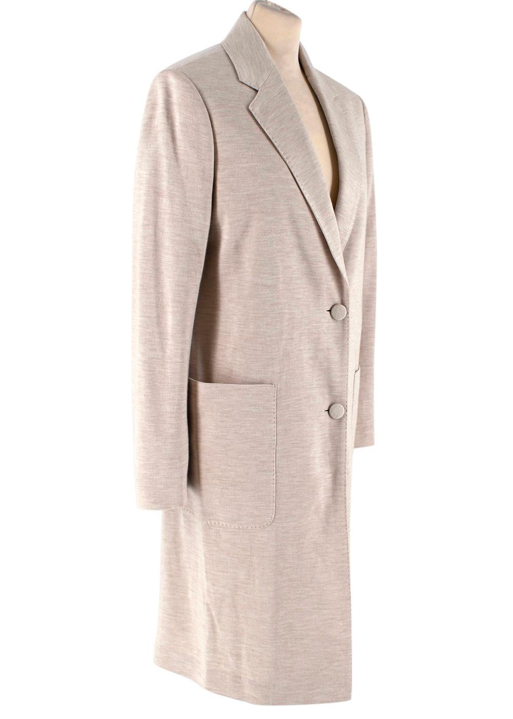 Agnona Beige Silk & Cashmere Blend Jersey Coat

-Made of a super soft cashmere and silk blend jersey fabric 
-Classic elegant cut 
-Gorgeous neutral hue 
-Pockets to the side 
-Button fastening to the front 
-Top stitching details 
-Partially lined