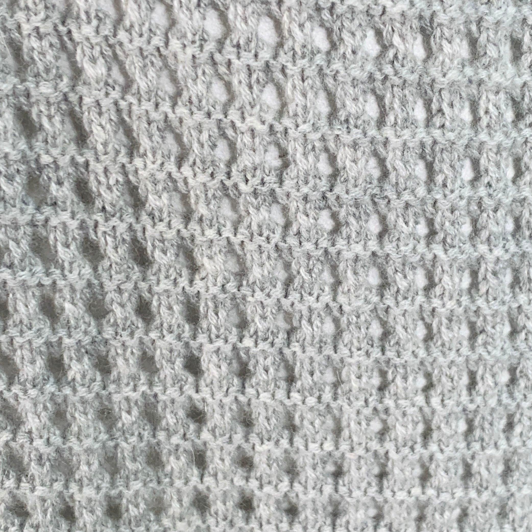 AGNONA cardigan
in a heather grey cashmere knit featuring a mesh design, long sleeves, and open front. Made in Italy.Excellent Pre-Owned Condition. 

Marked:   L 

Measurements: 
 
Shoulder: 32 inches Bust: 56 inches Sleeve: 21 inches Length: 36