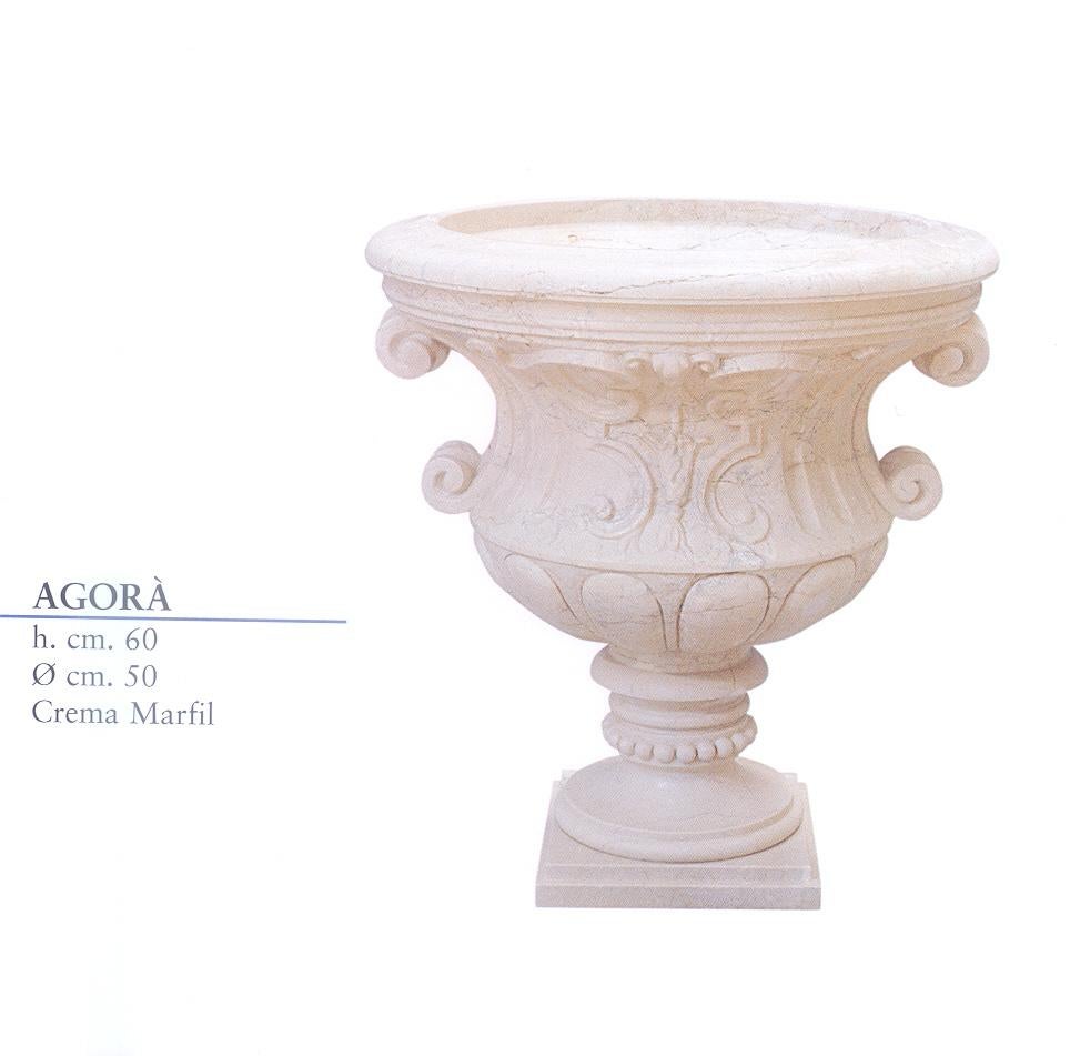 Multi-purpose Agora urn in crema marfil marble. Perfect for garden or home decor.