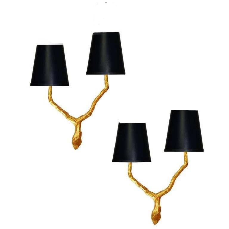 Pair of two arms doré bronze sconces by Arlus in the style of Agostini. Two lights per sconces, 60 watts max per light. US rewired and in working condition. Dimension without shades: 14