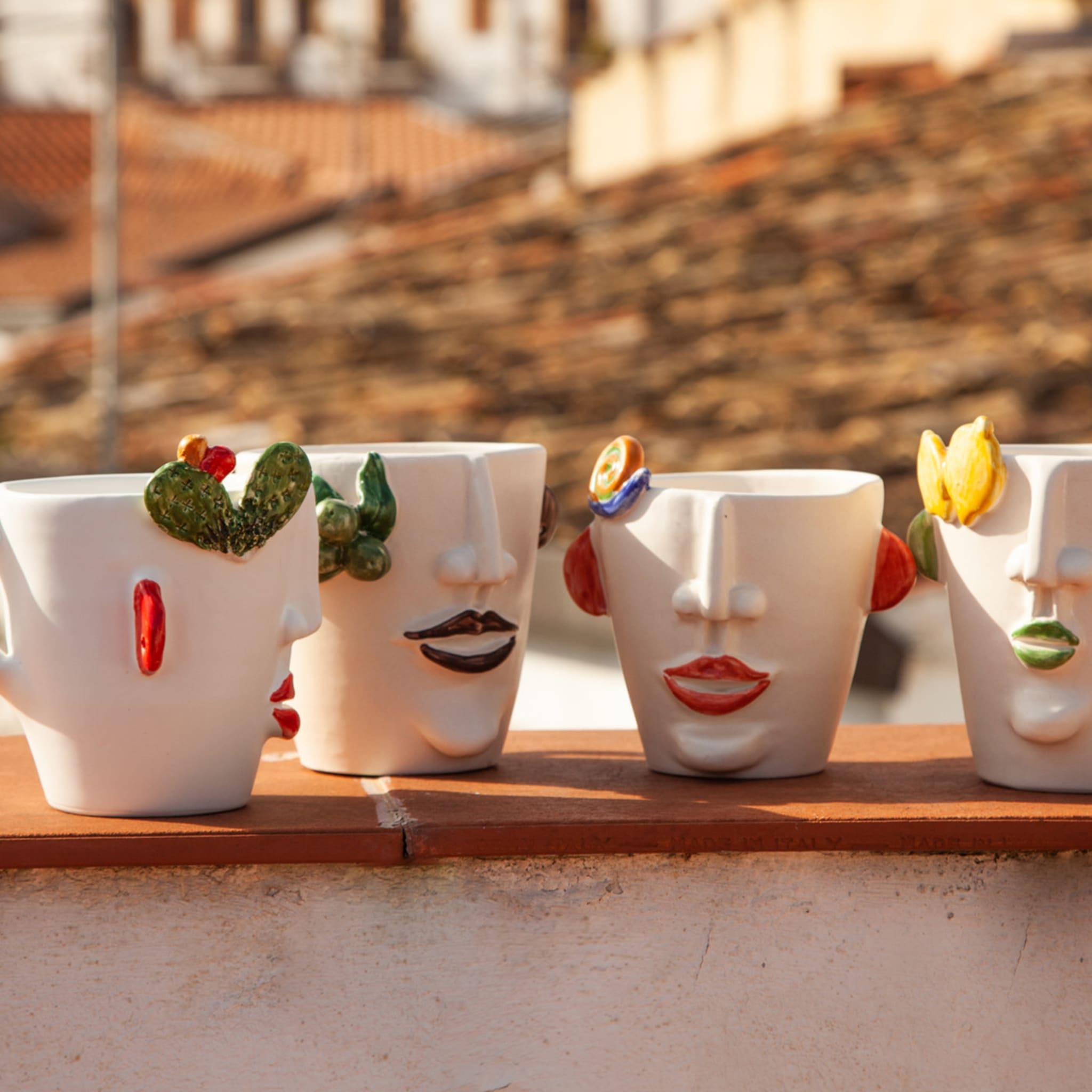 This outstanding set of three ceramic mugs glazed in matte white belongs to a creative series of pieces handcrafted by Patrizia Italiano to celebrate different types of Sicilian street vendors. Dedicated to Carmelina - seller of prickly pears - the