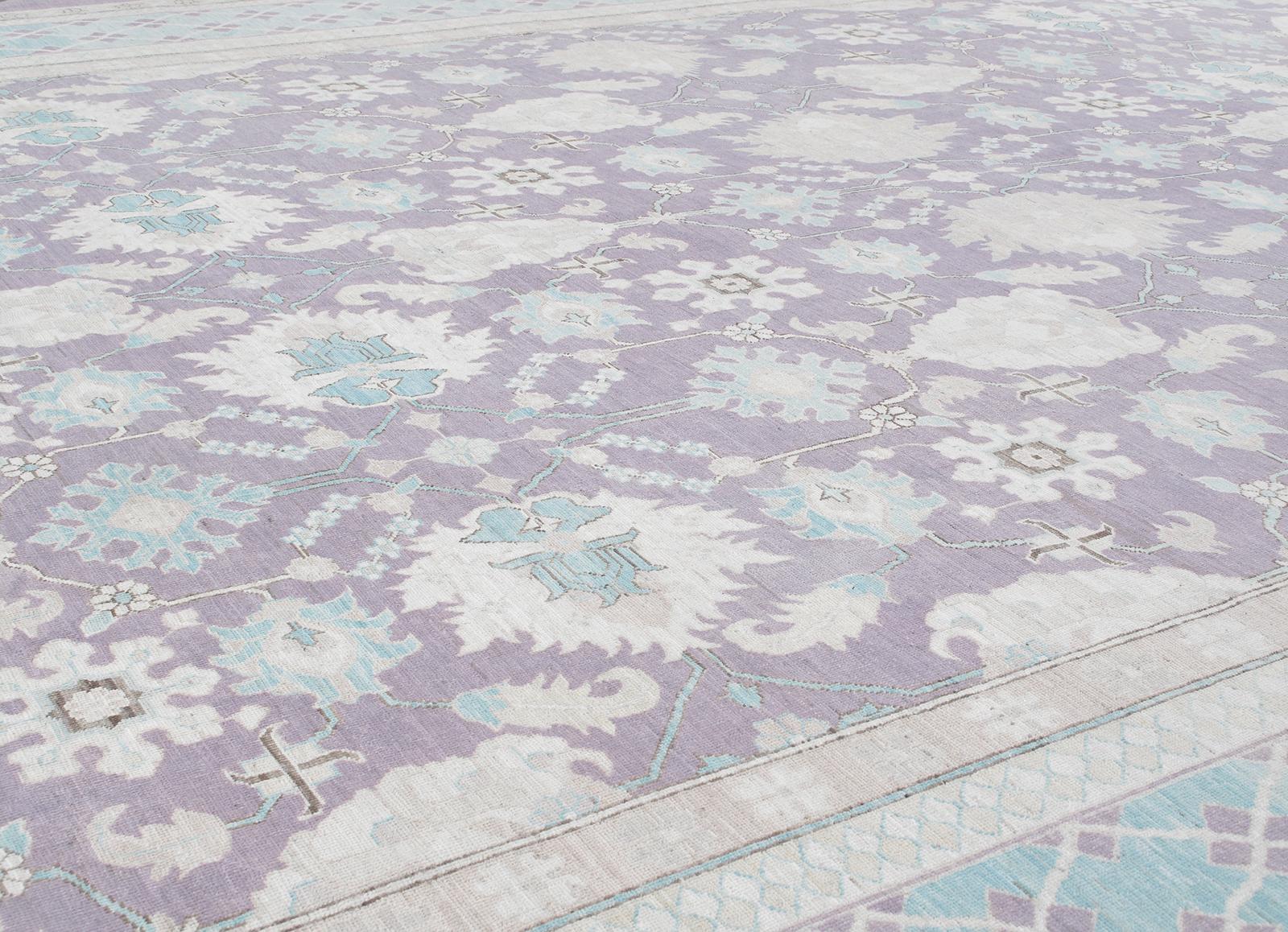 This Agra hand-knotted low pile rug is part of Nasiri's Decorative Patina collection and is made with the finest hand-spun wool. It is a reproduction of the notable and distinct rugs made in the Classic style of Maughai carpets of India. Very sought