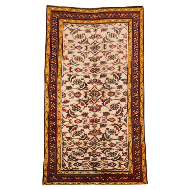 Agra Rug in Reds and Yellows on a Beige Background. For Sale