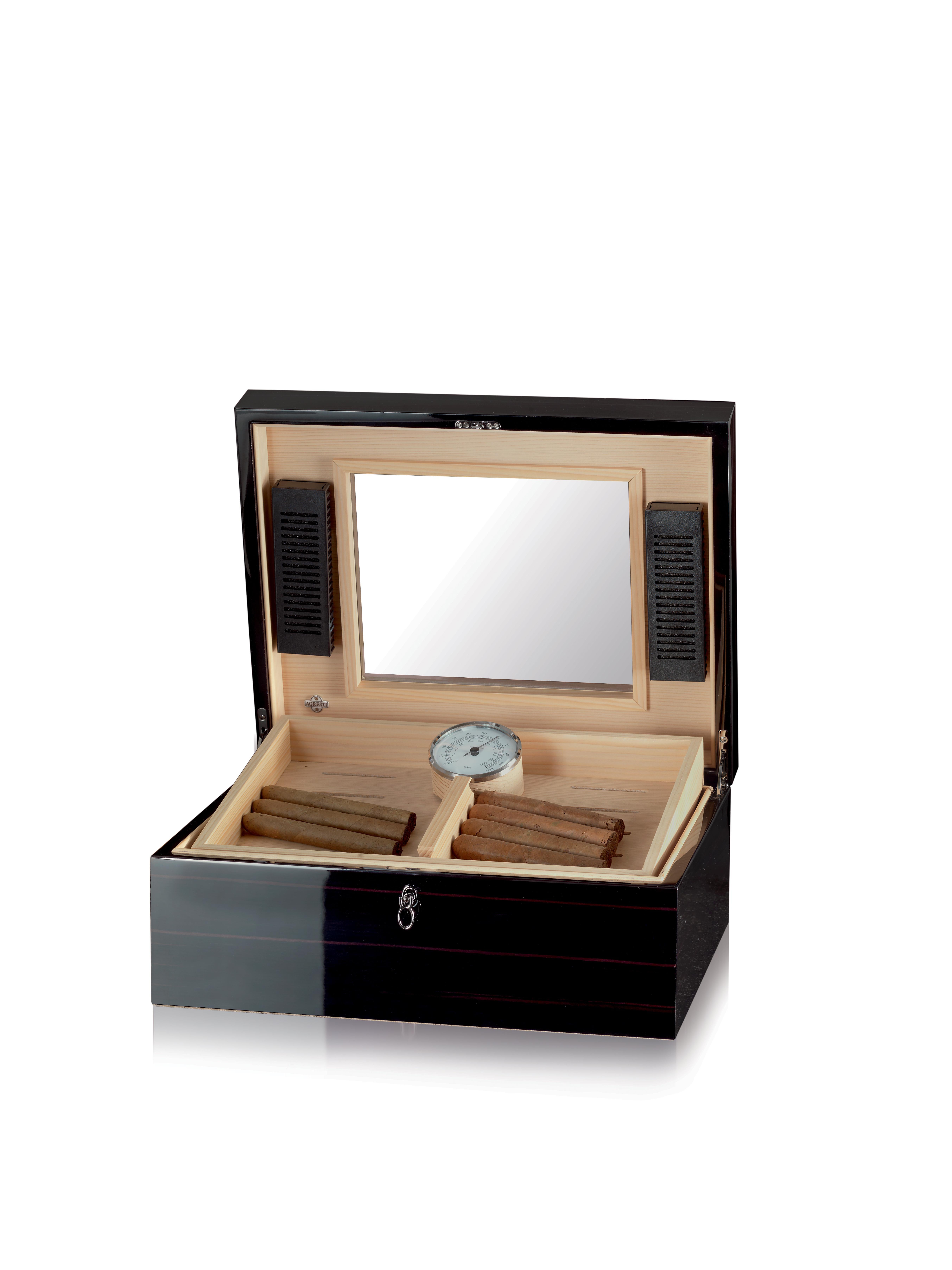 Humidor for 100 cigars in ebony polished. Cedar lining. Two humidification units and hygrometer. Removable tray.
 