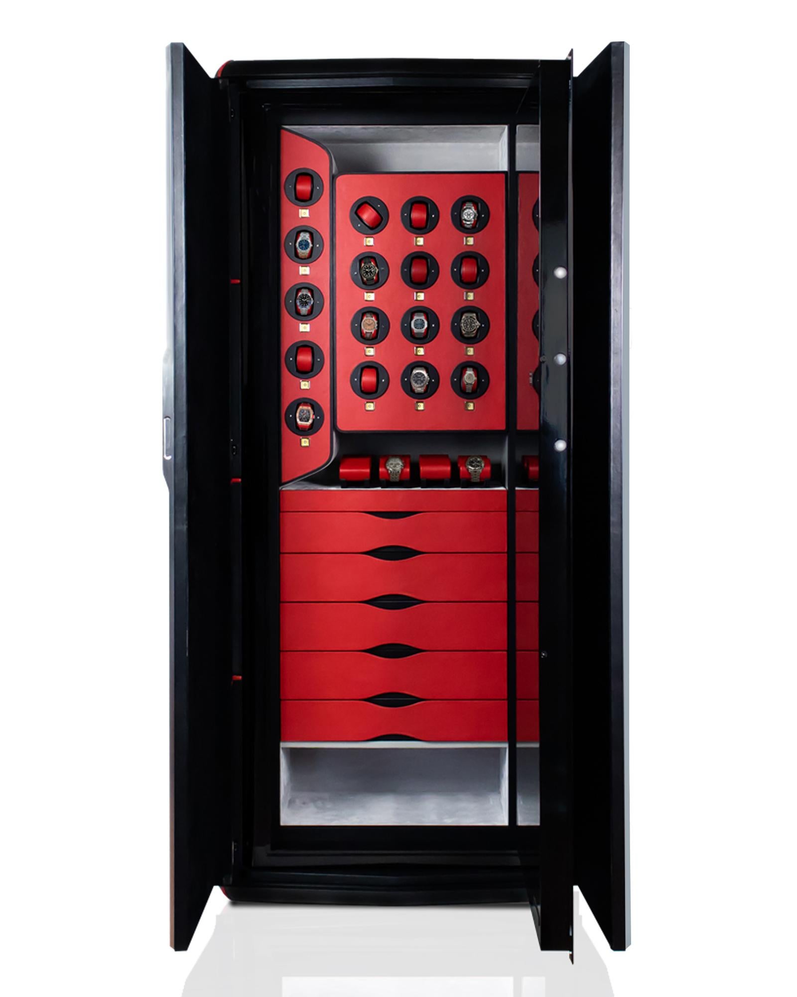 Armoured armoire for watches and jewels lined in black leather and details in red leather. Accessories in satin palladium. Inside the safe 17 watch winders made in Switzerland and a secret compartment.
Drawers covered in leather and inside lined