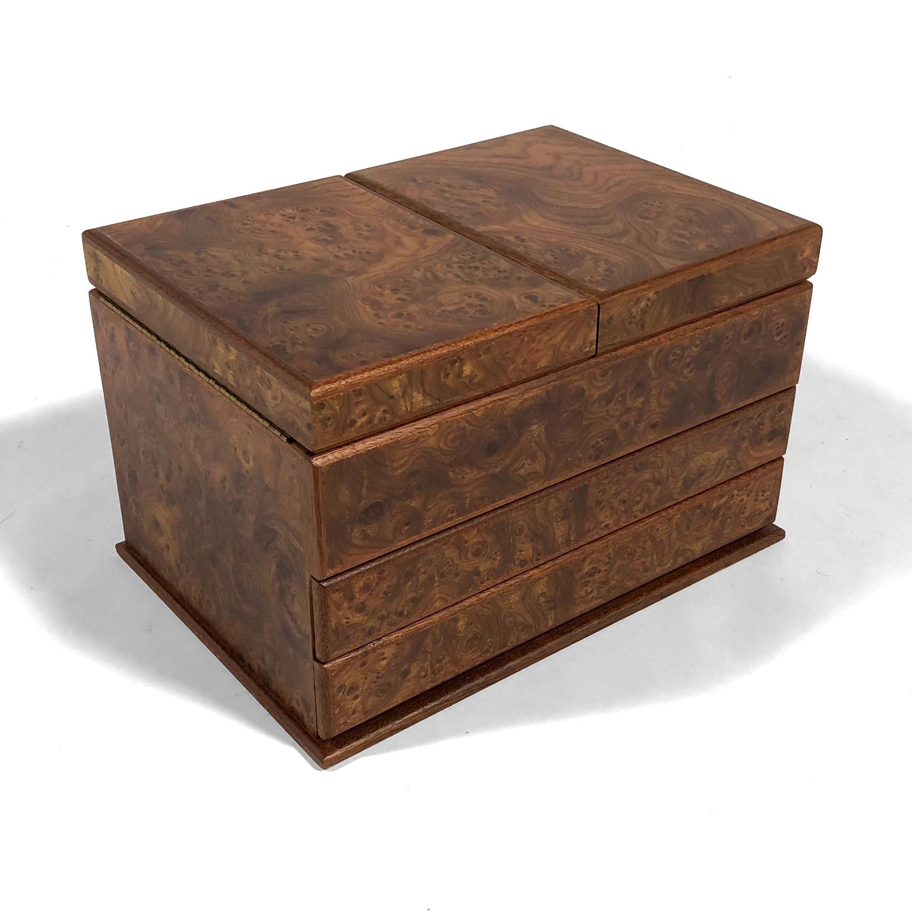 This stately chest made in Italy by Agresti is clad in beautifully figured elm brair can accommodate 18 watches on holders and laying down.