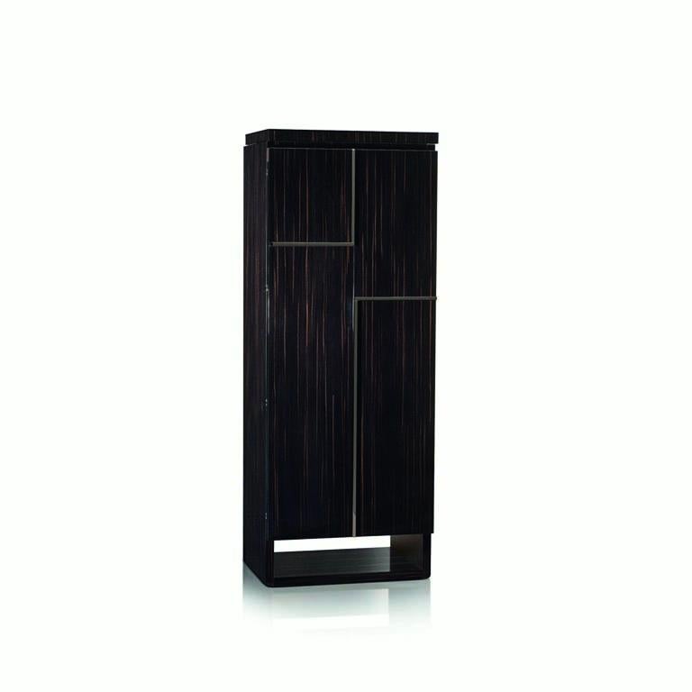 Polished ebony contemporary armored armoire by Agresti.

Matte finish, ruthenium accessories. Inside drawers for jewelry, with fronts covered in white leather.
Safe can be anchored to the wall with metal screws that are supplied. Opening with