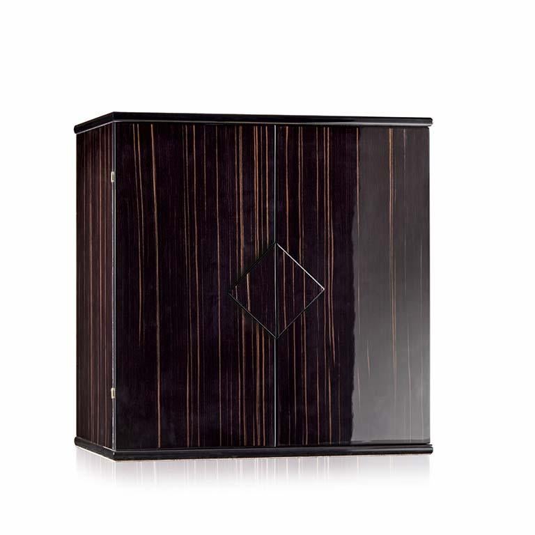 The Agresti Nero Forziere chest safe is made of polished wood. It contains six drawers which are lined to store all sorts of jewels and has a necklace bar. Brass-plated, 24-karat gold accessories. Unique features of this certified product includes: