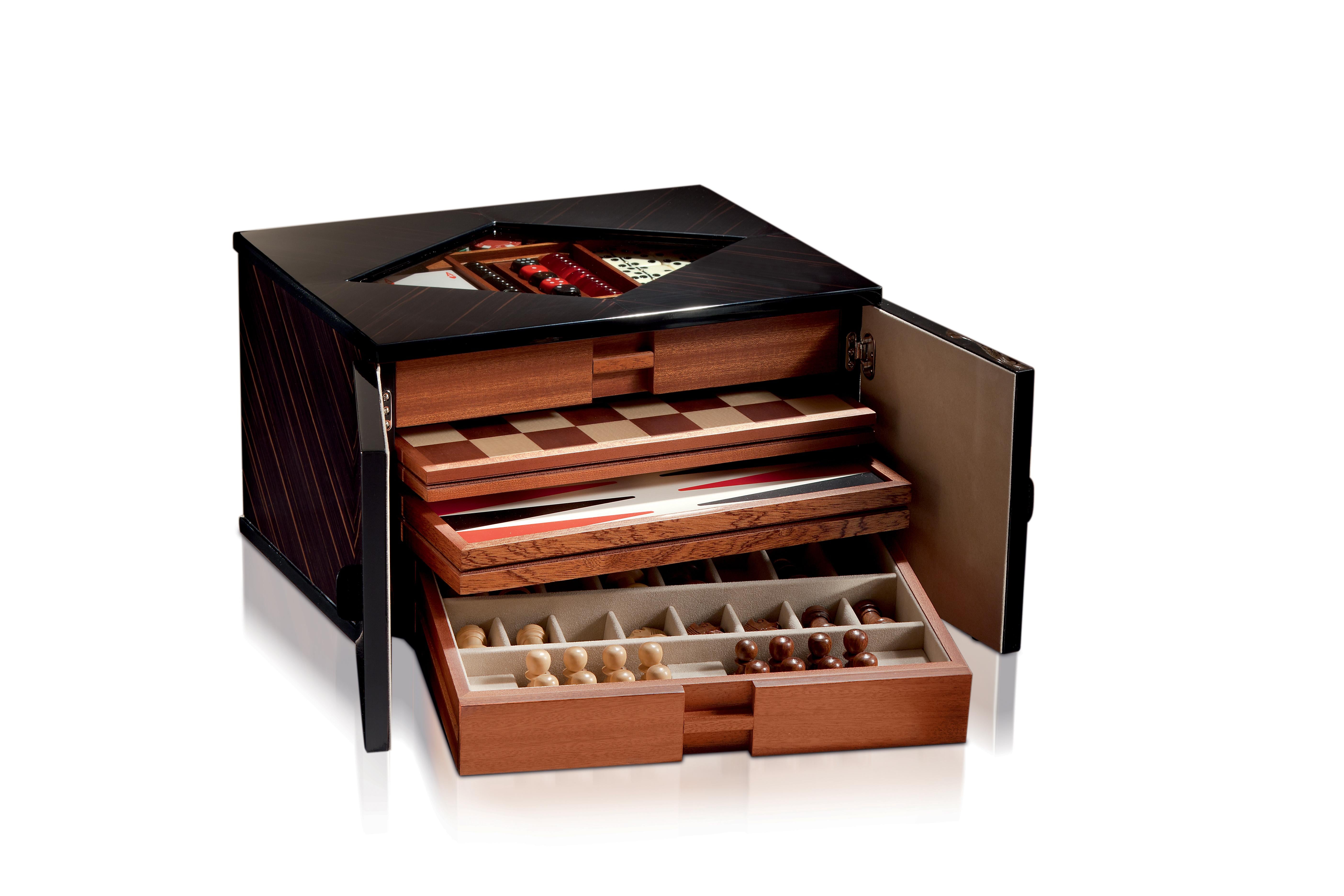 Polished ebony multigame. Contents chess, backgammon, dice, domino, playing cards and poker chips.
 