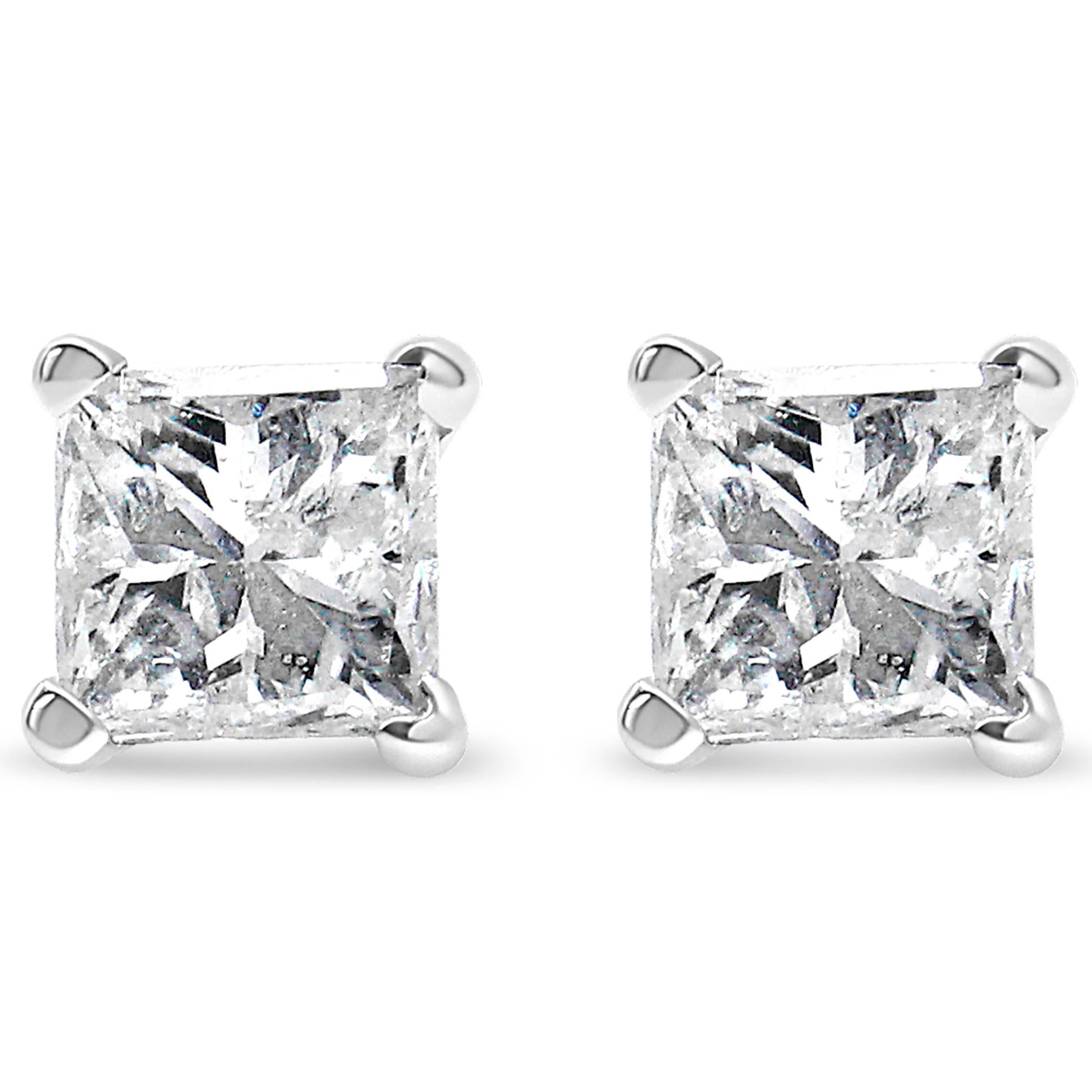 Celebrate any occasion with these classic shimmering diamond stud earrings. Fashioned in 14K white gold, each earring showcases a sparkling square shaped, brilliant cut certified diamond solitaire. Dazzling with a bright polished shine, these post