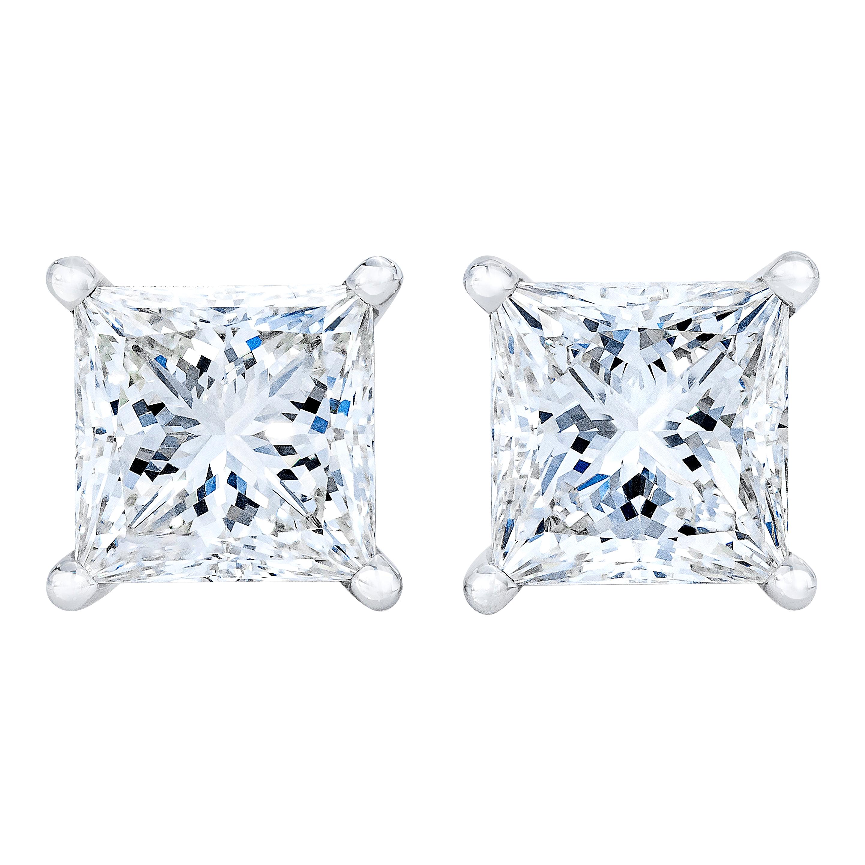 Celebrate any occasion with these classic shimmering diamond stud earrings. Fashioned in 14K gold, each earring showcases a sparkling square shaped, brilliant cut certified diamond solitaire. Dazzling with a bright polished shine, these post