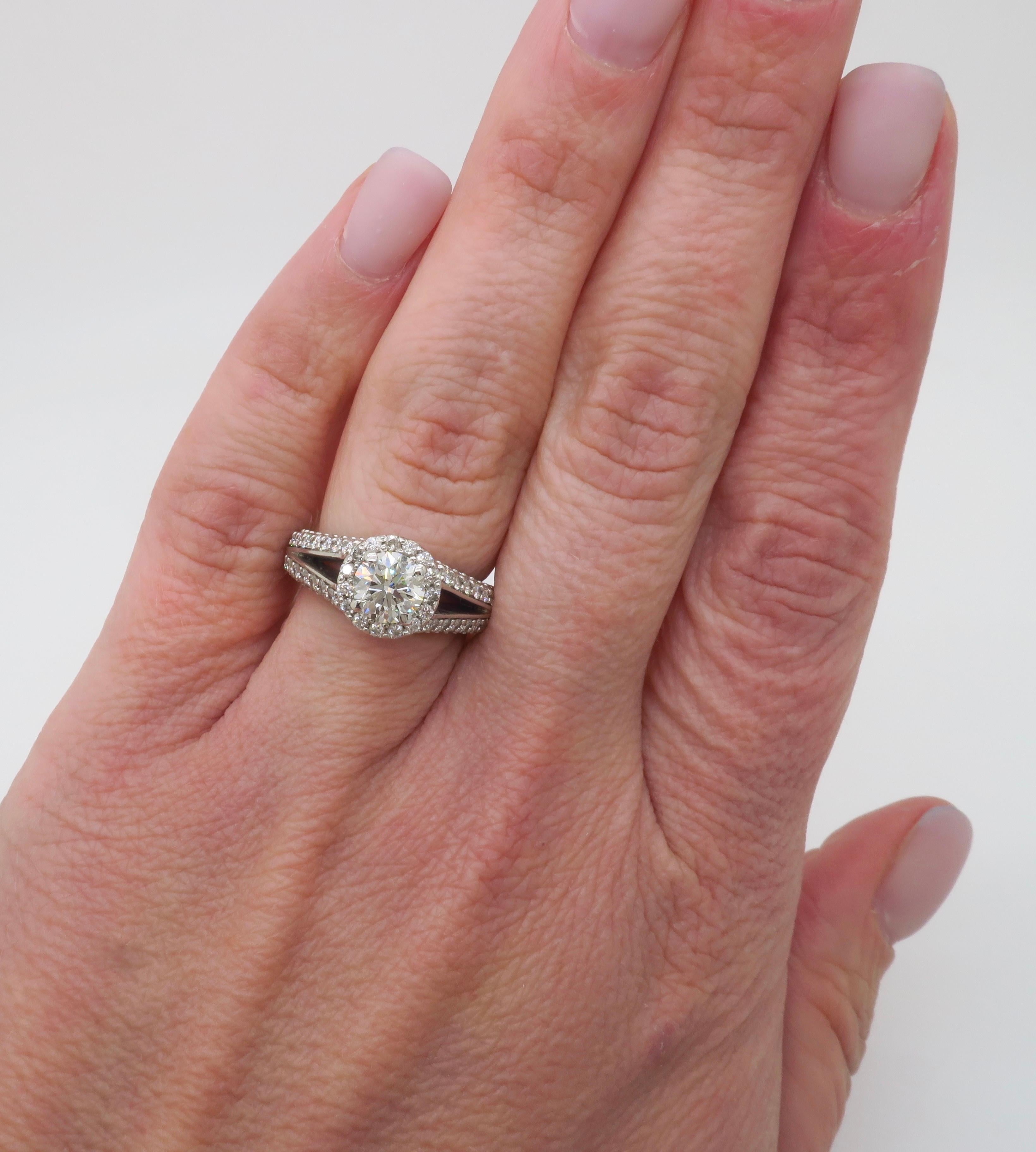 Stunning Certified Brian Gavin Diamond Halo Engagement Ring made in Platinum. 

Center Diamond Carat Weight: .83CT Earth Mined
Center Diamond Cut: Round Brilliant Cut 
Center Diamond Color: J
Center Diamond Clarity: VS2
Certification: AGS: