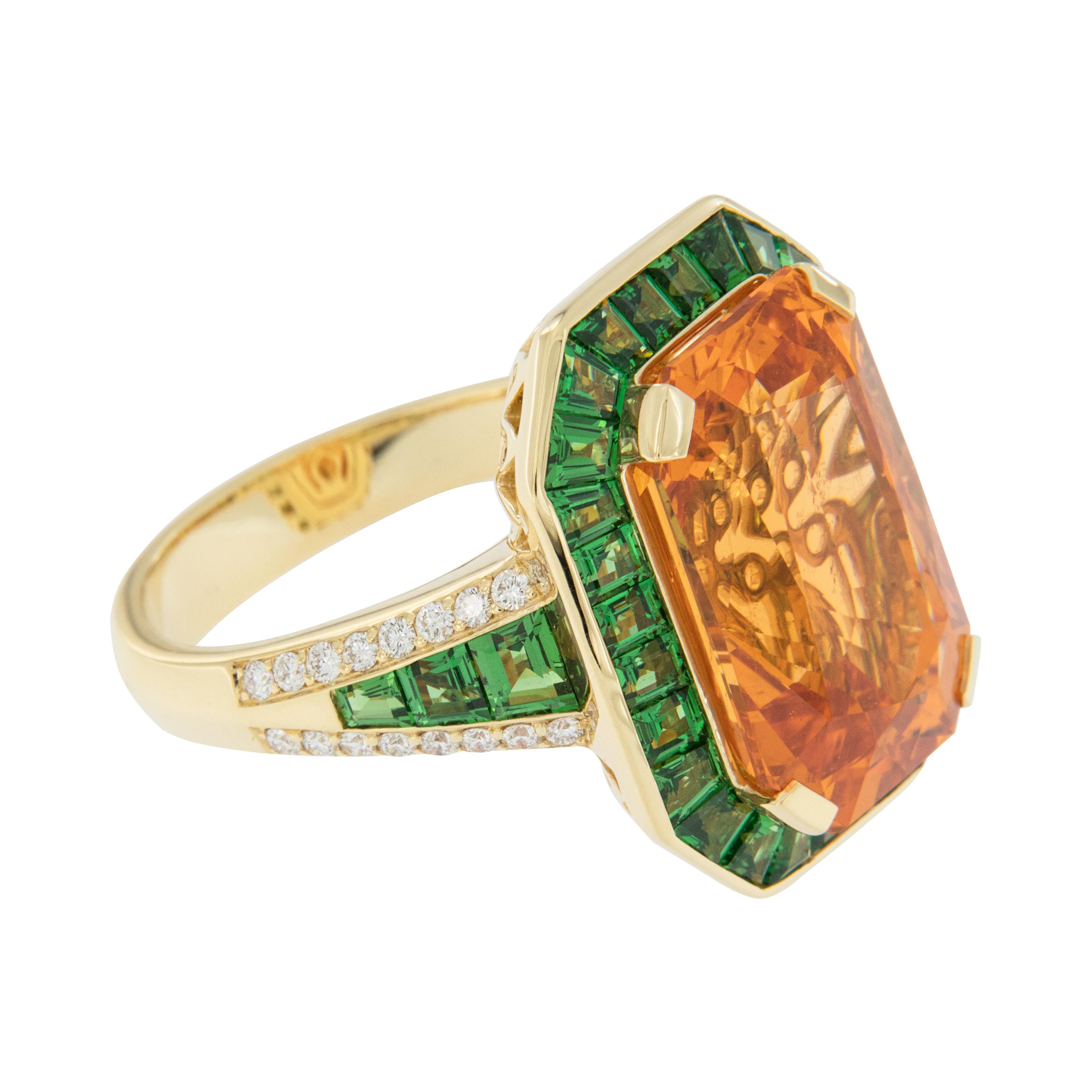  This Art Deco inspired, custom cast 18 karat yellow gold ring is set with one octagonal mixed cut Spessartine Garnet = 13.13 carats, being FANTA orange in color, VVS clarity and measuring 15.55 x 10.38 x 7.52mm with GIA Identification Report