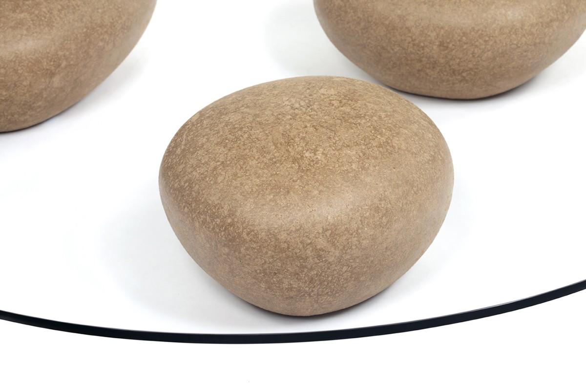 Água table by contemporary artist Domingos Tótora. Made of recycled cardboard. The Água table comprises of three pebble-like shapes under a glass top that resemble water washing over stones. About the artist: Domingos Tótora (born and raised in