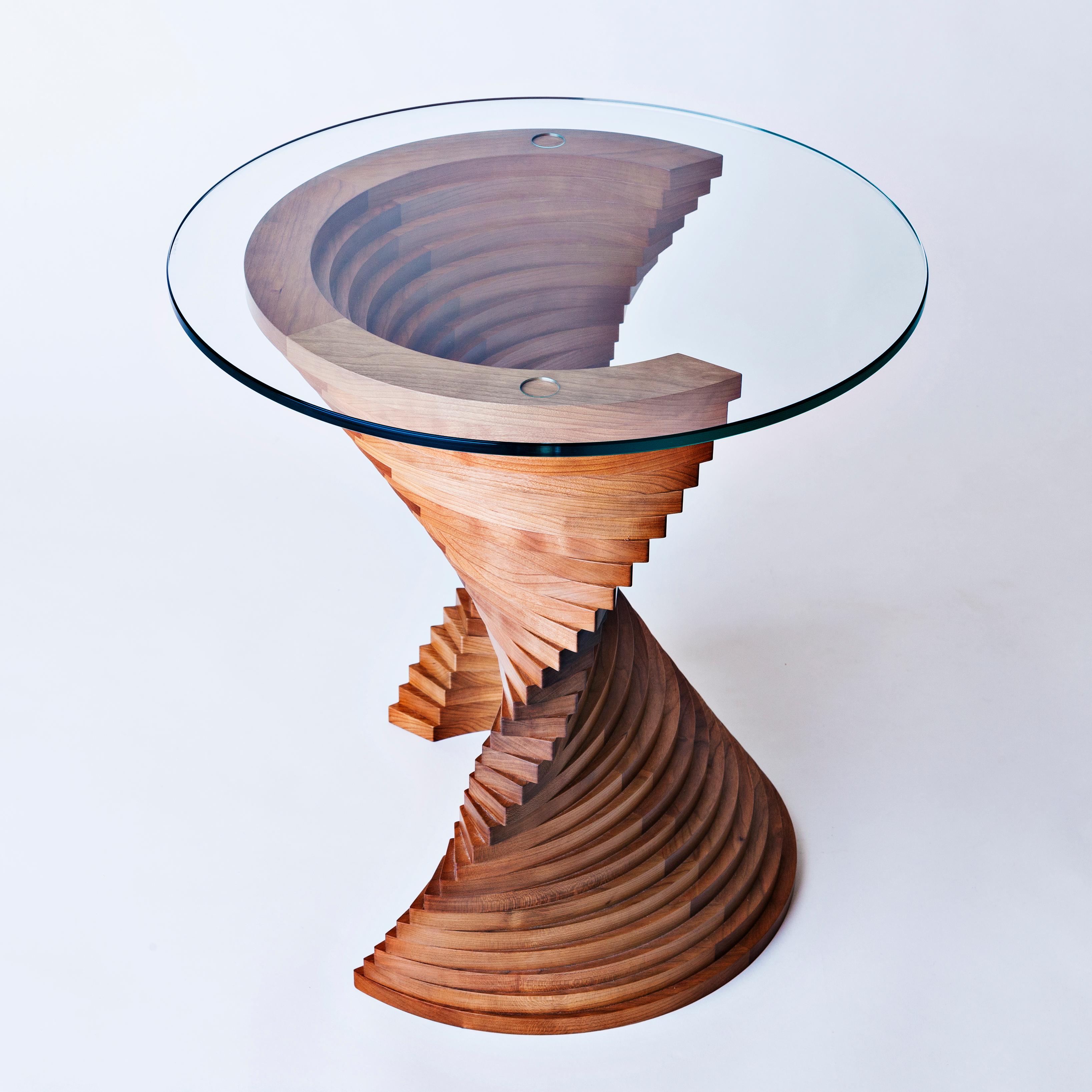 Aguaviva side table by David Tragen
Limited Edition of 12
Dimensions: W 52 x D 52 x H 54 cm
Materials: American Walnut
Also available in American Cherry

The concept behind Into the Abyss, was the disintegration of matter as it enters a black