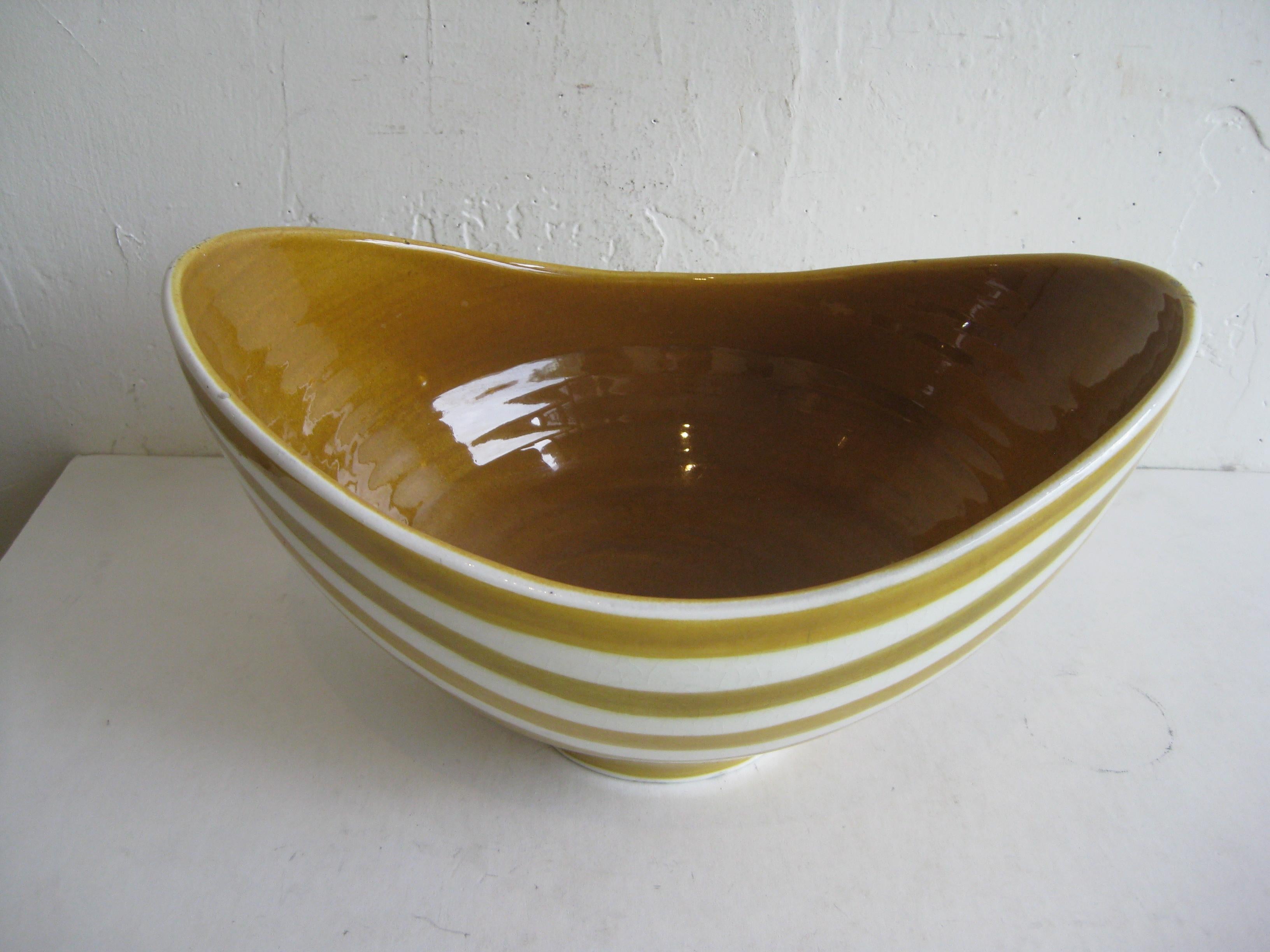 Fantastic large abstract modernist Swiss pottery/ceramic bowl by A-H KAG, circa 1960s. Great color and form. Signed on the bottom and was made in Switzerland. In very nice original condition. Has a couple very small flea-bites to the original glaze,