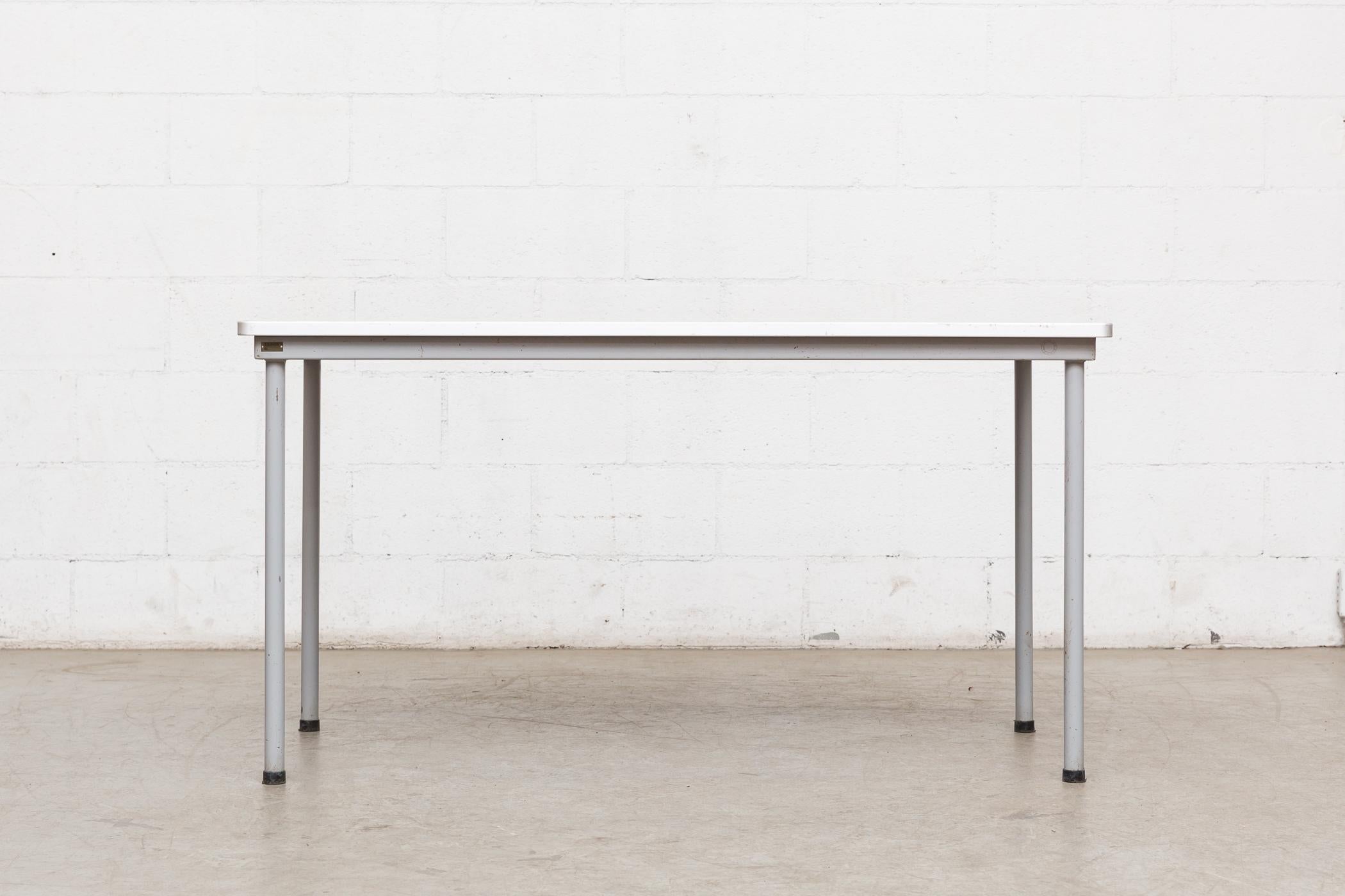 Industrial enameled grey frame with printed formica top. Great dining table, desk or work table from the University of Delft. Original manufacturer metal tag with item number, as pictured.