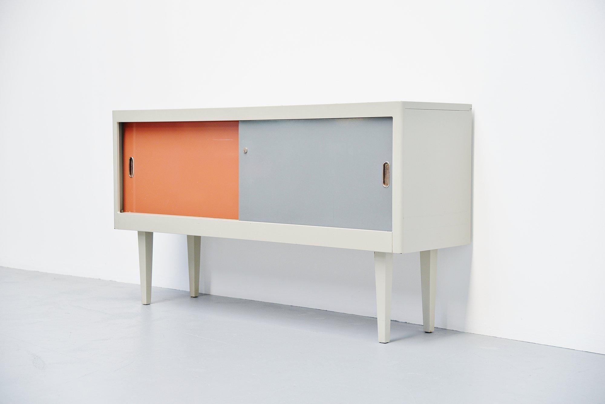 Very nice and rare industrial sideboard designed and manufactured by Ahrend de Cirkel, Holland 1960. This sideboard was an own production by Ahrend in the period that Friso Kramer and Wim Rietveld where active so who knows which influences they had