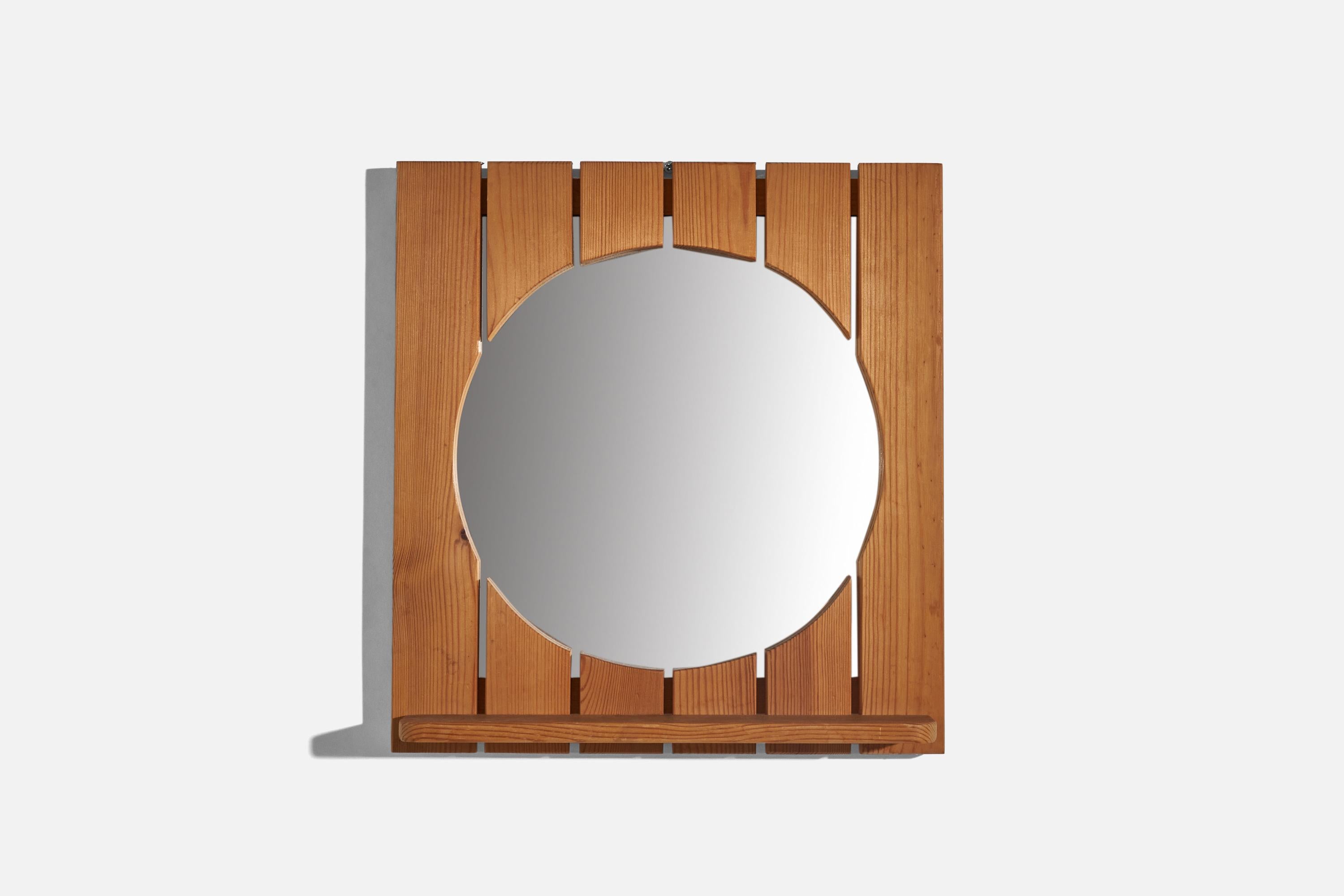 A solid pine wall mirror designed and produced by Ahrnbergs, Sweden, 1970s.