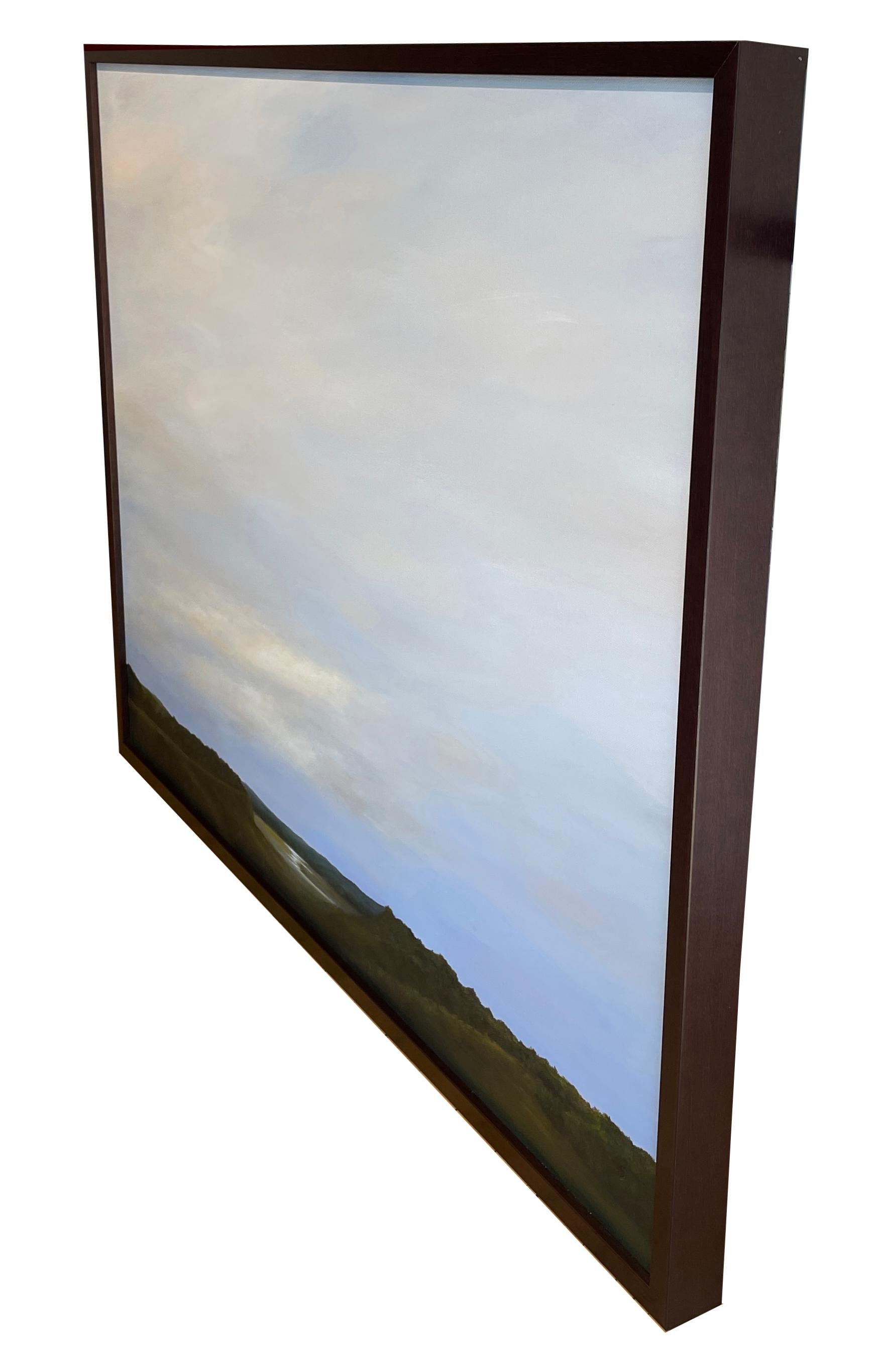 The sun tries to peak through the cloud filled sky as it casts a yellow hue to the horizon.  The reflection is seen on the pond below adding to the serene calm of this original oil painting.  It is framed in a simple dark wooden frame measuring 31 x