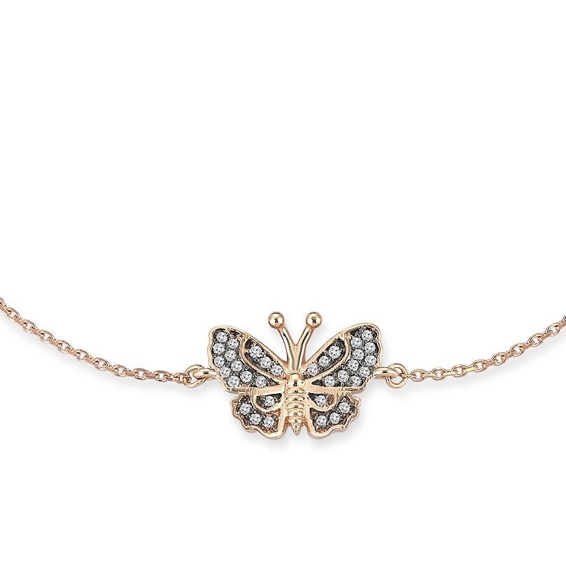 Aida Bergsen’s Butterfly Bracelet is set in 14k rose gold with brilliant cut white diamonds and rhodium plating which plays a role in further highlighting the light and shadow.

Completed with the signature Aida Bergsen stylised snake logo, this