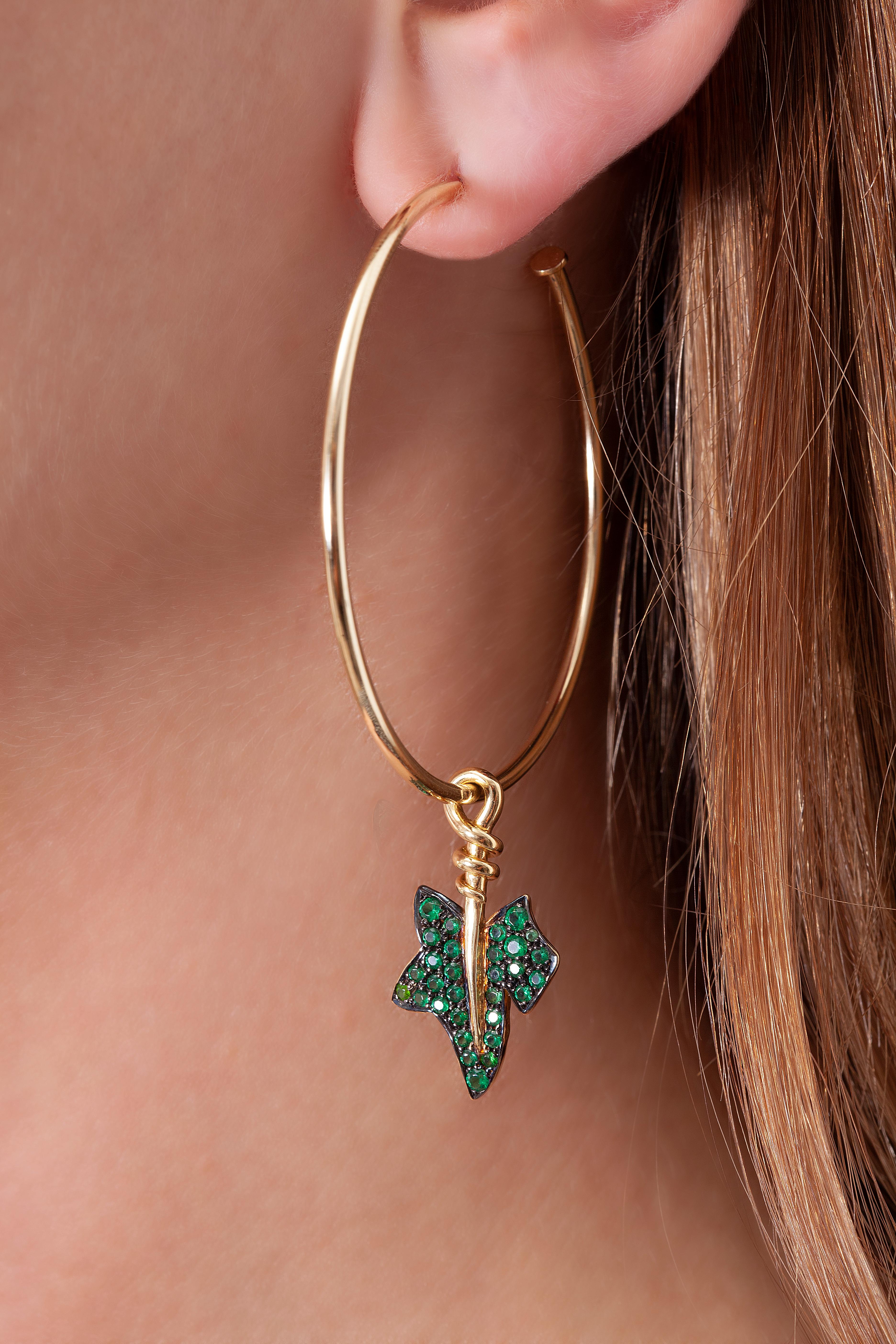 18K yellow gold set with 1,24 carat green garnets.

Belonging to the stacking series of the Flora Collection, the Large Green Hedera Hoop Earrings are the perfect everyday companion to compliment any style. Additional charms from the series can be