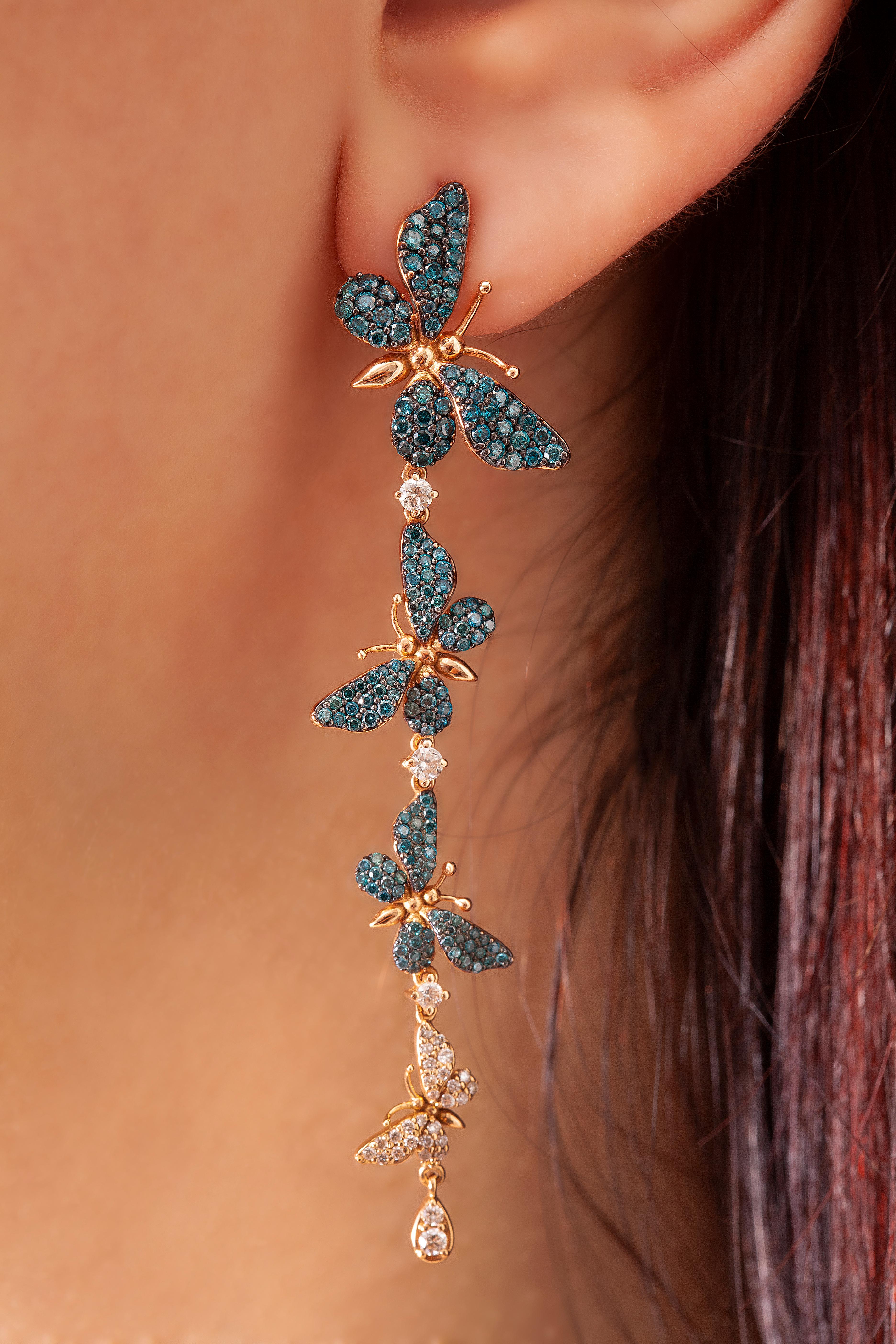 Long Blue Flutter Earrings are set in 18k rose gold with 1,76 carat blue diamonds and 0,50 carat white diamonds.

Enticing and fun, the Flutter Earrings mimic those evanescent yet remarkable feelings of butterflies with its fluid movement and