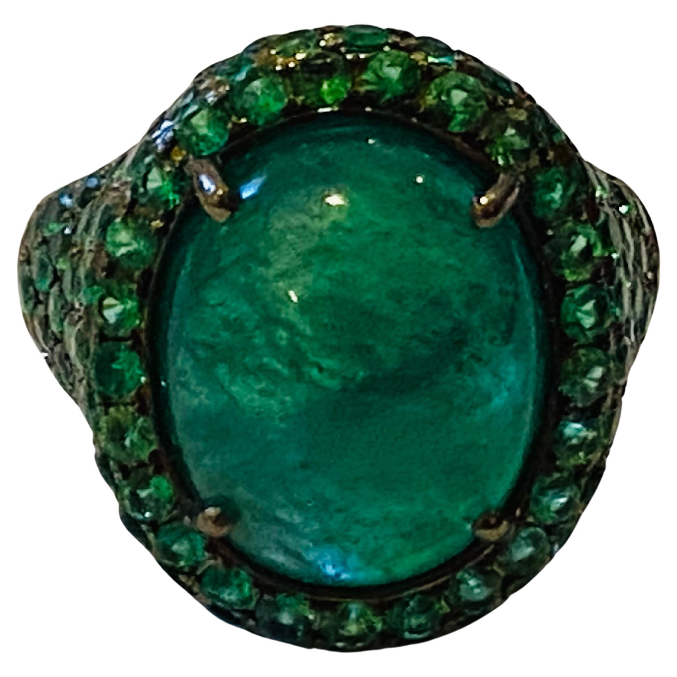 From contemporary collection, an exquisite and modern design,  elegant and chic.
Ring come in 18k gold with a big  natural Zambian Emerald in cabochon cut  of 10 carat , spectacular colors and perfect cut, fine quality, and round brilliant cut