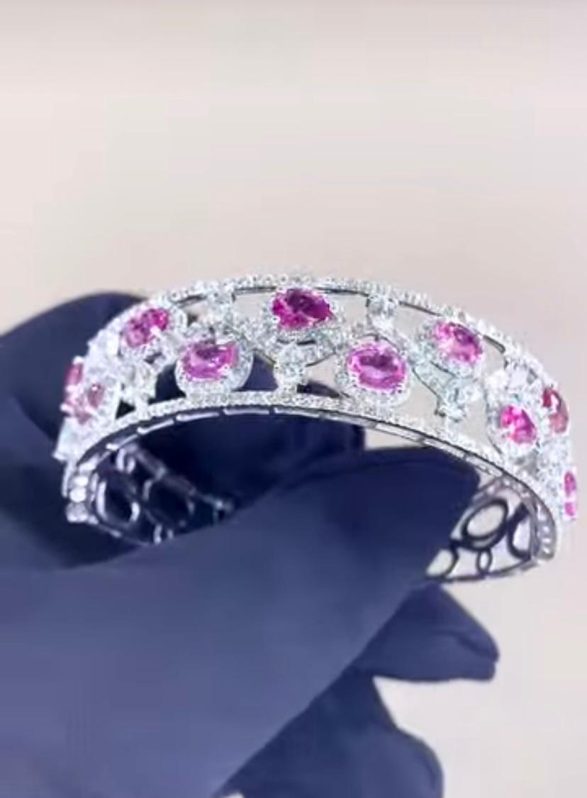 This exquisite bracelet features Ceylon Pink Sapphires and sparkling diamonds, creating a stunning contrast. This piece is truly fantastic, adding a touch of elegance and allure. This vibrant masterpiece is a celebration of color and luxury, exuding