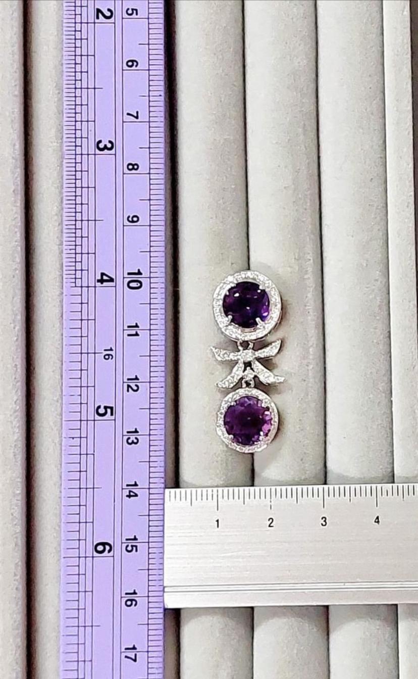 An exclusive pair of earrings , in sophisticated a d fashion design, perfect for spring/ summer season. Adds a touch of colors on your look.
Stunning earrings come in 18k gold with 4 Natural Untreated Amethyst, in perfect oval cu, of 10,90 carats,