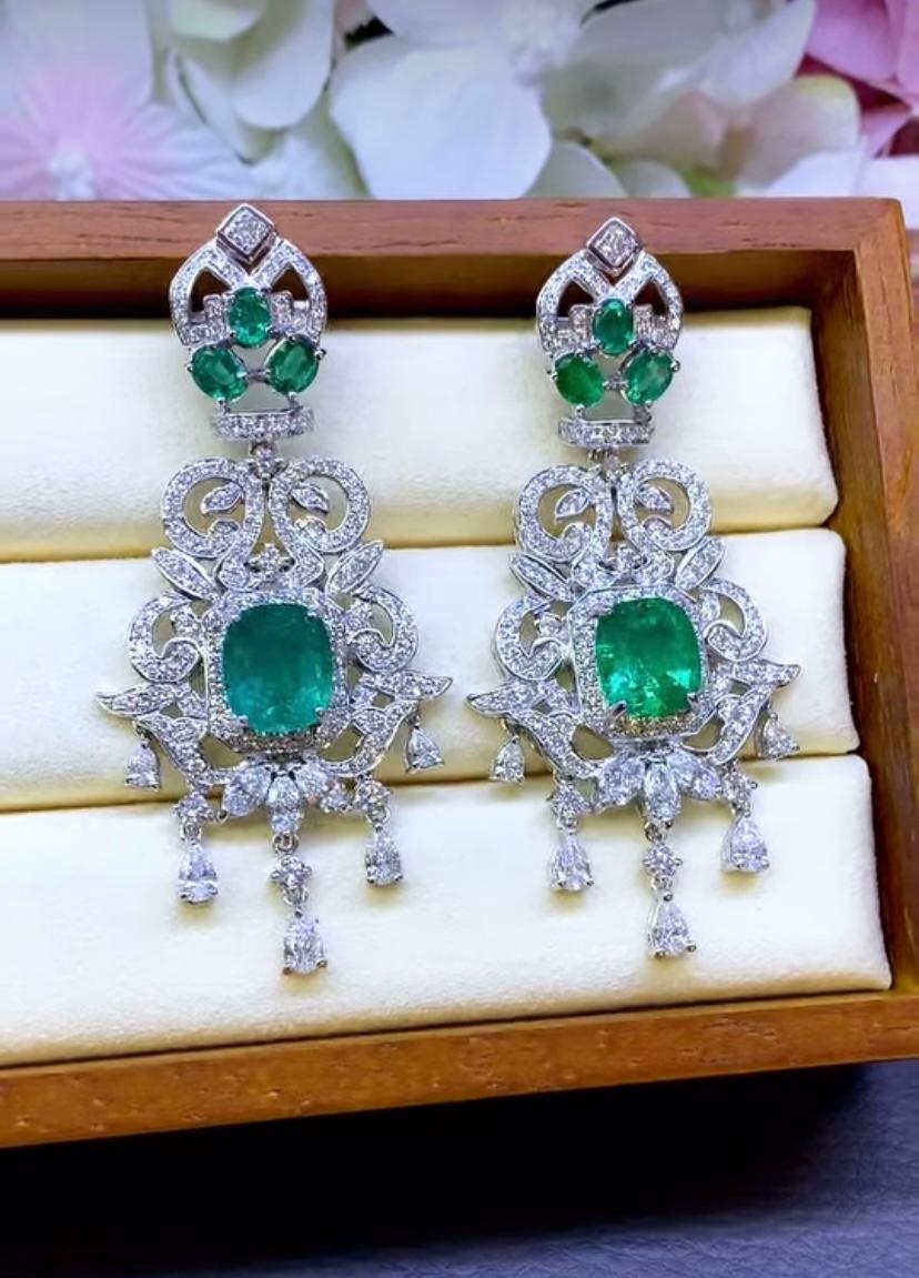 Unique and elegant Emeralds and Diamonds earrings.  
The emeralds are arranged in the shape of delicate design , surrounded by shimmering diamonds that add a touch of sophistication.
The intricate craftsmanship and vibrant colors , make these