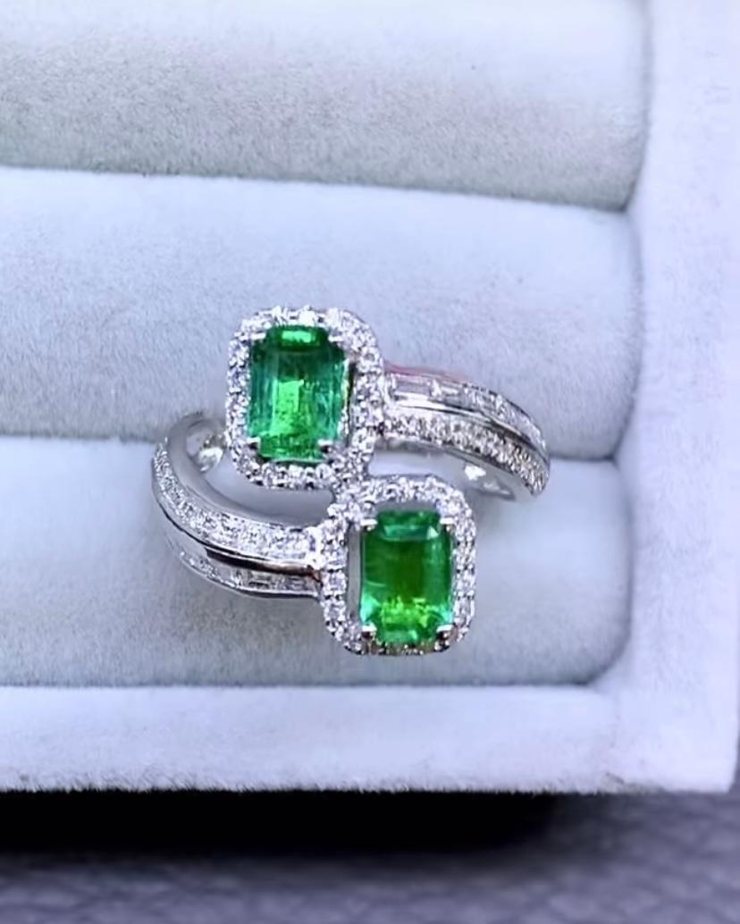 Emerald Cut AIG Certified 1.21 Ct Zambian Emeralds  Diamonds 18k Gold Contraire Ring For Sale