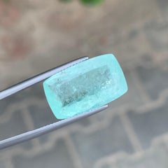 Gema natural suelta de turmalina paraiba de 13.80 quilates en talla cojín certificada por AIG
