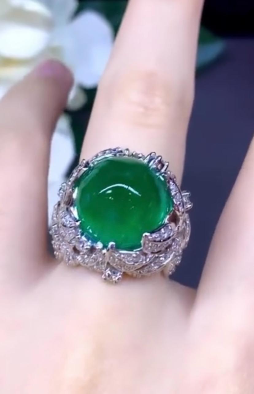 Impressive big size Cabochon Zambian Emerald and Diamonds ring, a truly unique piece of jewelry that is sure to turn heads and make a statement.
Crafted with exquisite attention to detail, this breathtaking ring features a gorgeous cabochon/oval