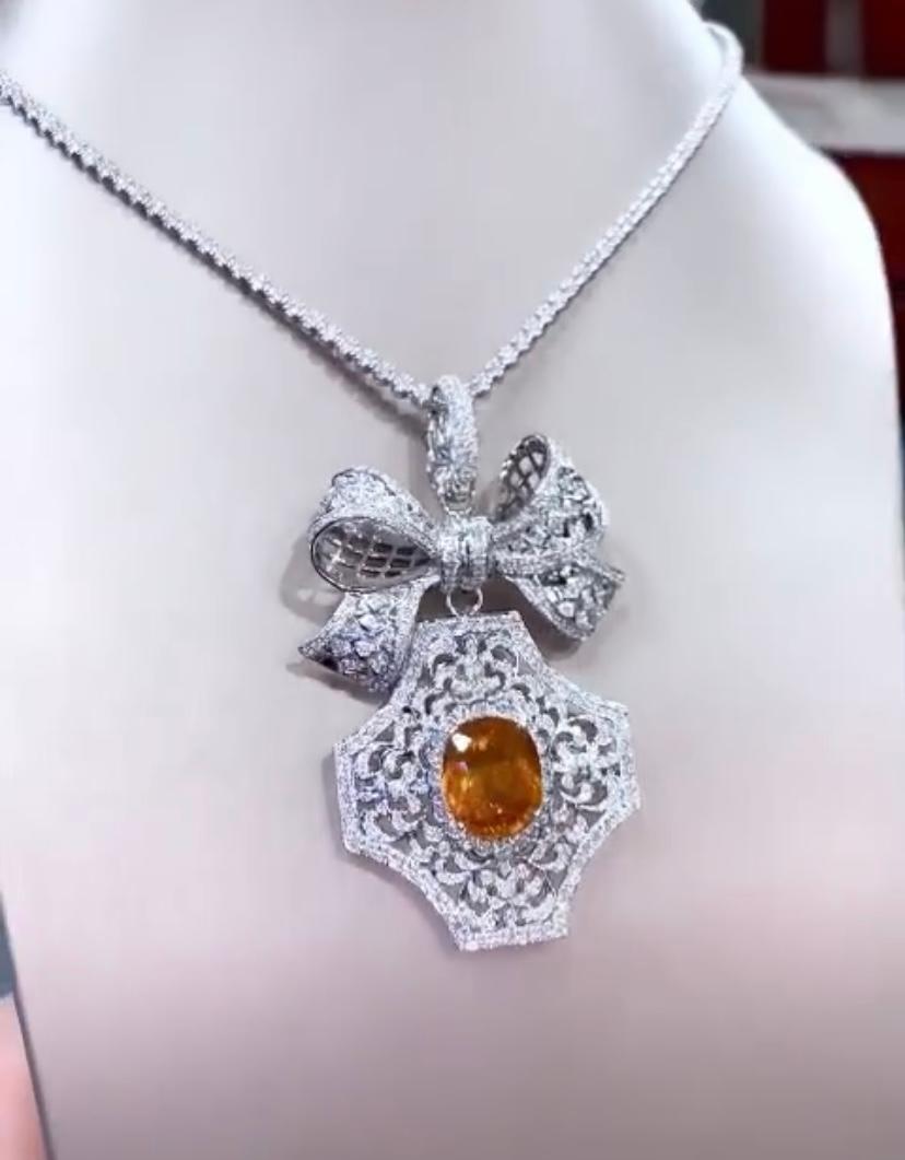 An exclusive pendant,  very chic style, sophisticated and refined design by Italian designer, ideal for glamour ladies.
Pendant come in 18K with a centre natural Orange Sapphire, in perfect oval cut, extra fine quality, stunning color , of 15,07