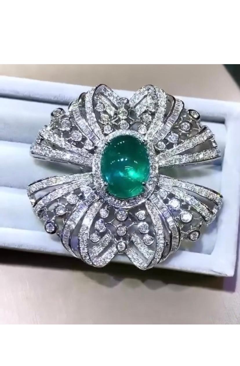 A stunning Art Deco brooch\pendant is a masterpiece of craftsmanship. The intricate design, with delicate and sparkling diamonds , and superbe emerald, is truly breathtaking. The attention to detail and precision in the creation of this amazing