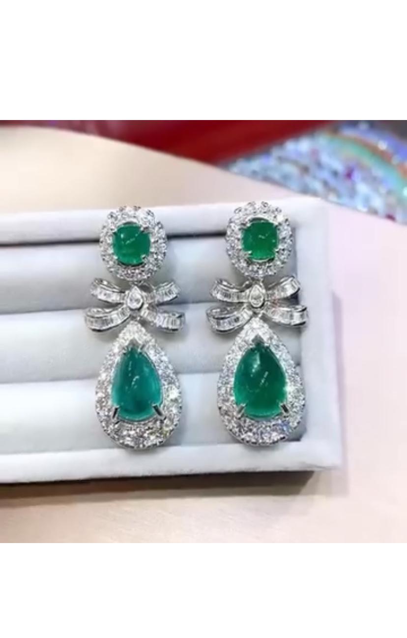 Unique and elegant Emeralds and Diamonds earrings.
The emeralds are arranged in the shape of a delicate design, surrounded by shimmering diamonds that add a touch of sophistication. 
The vibrant colors make these earrings a truly special and