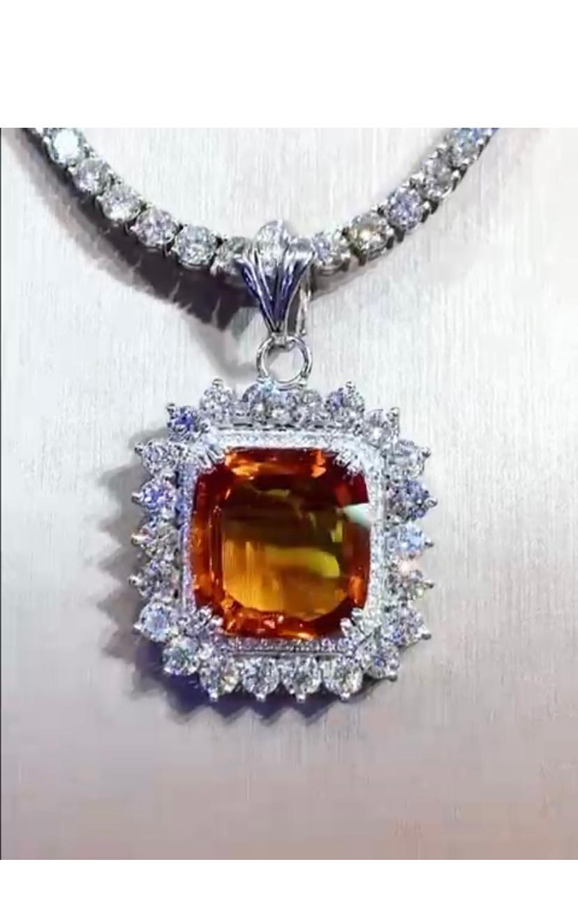 An exquisite design , so elegant and refined, a very adorable style.
Pendant come in 18k gold with a natural Orange Sapphire, fine grade and excellent quality, of 17 carats , and round brilliant cut diamonds of 5 carats, G-H/VS .
Handcrafted by